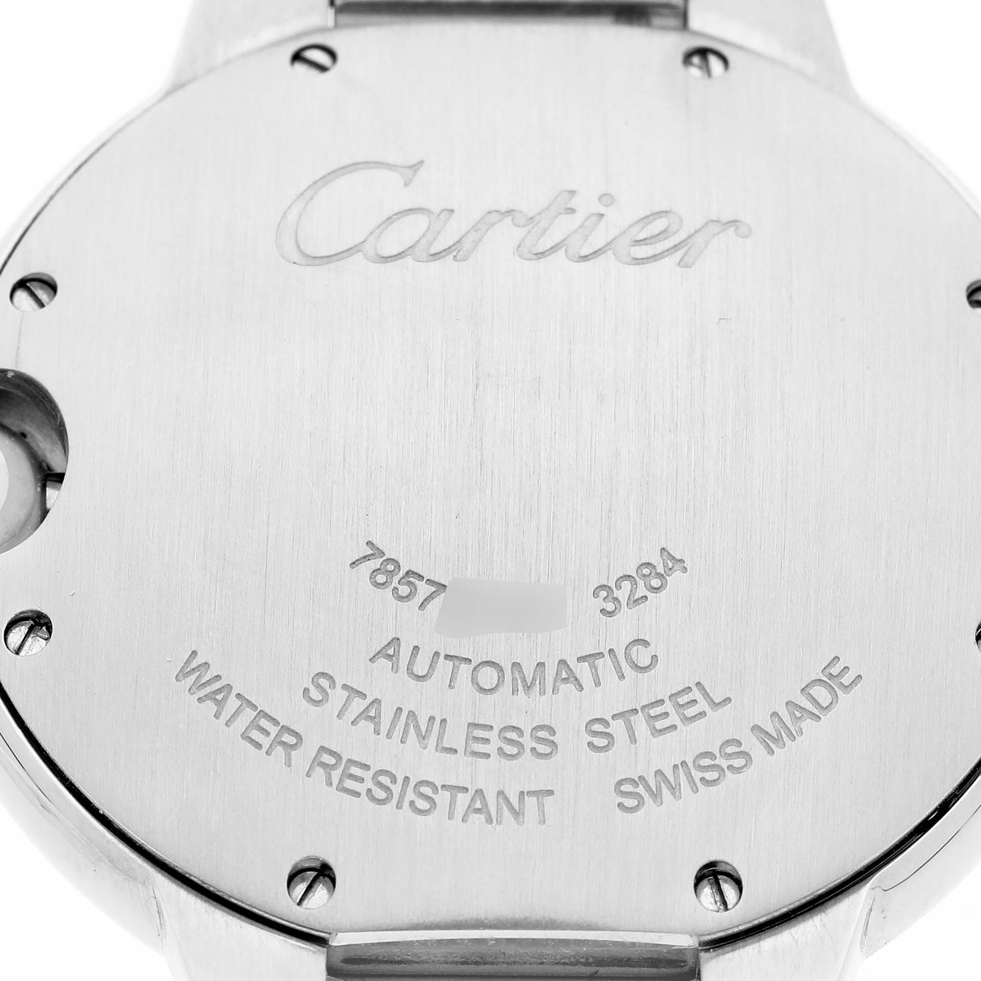 The image shows the back case of a Cartier Ballon Bleu W6920046 Women's Stainless Steel Silver Dial watch, highlighting engraved details and labeling.
