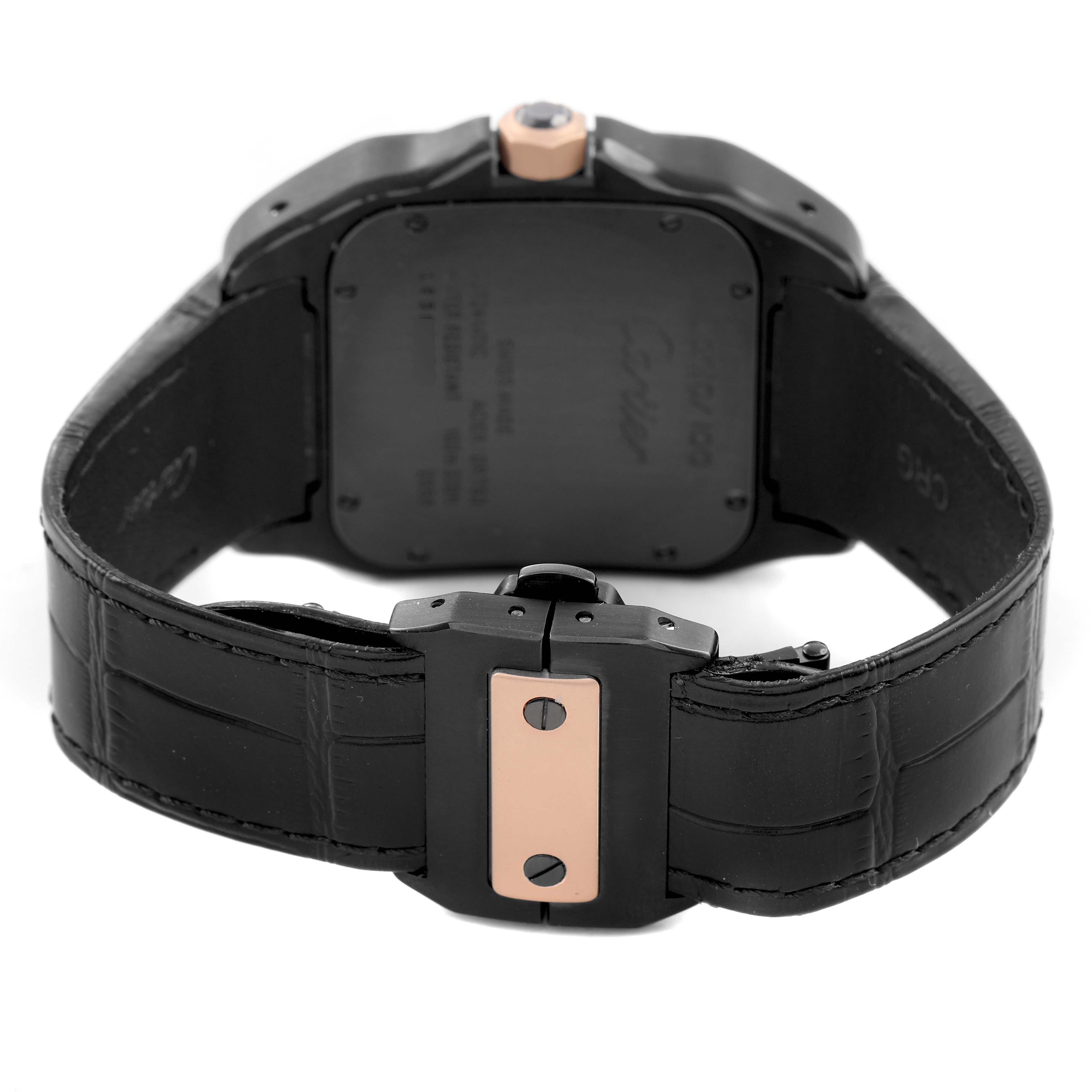 The image shows the back of a Cartier Santos W2020007 Men's Stainless Steel Black Dial watch, highlighting the case and leather strap with its clasp.