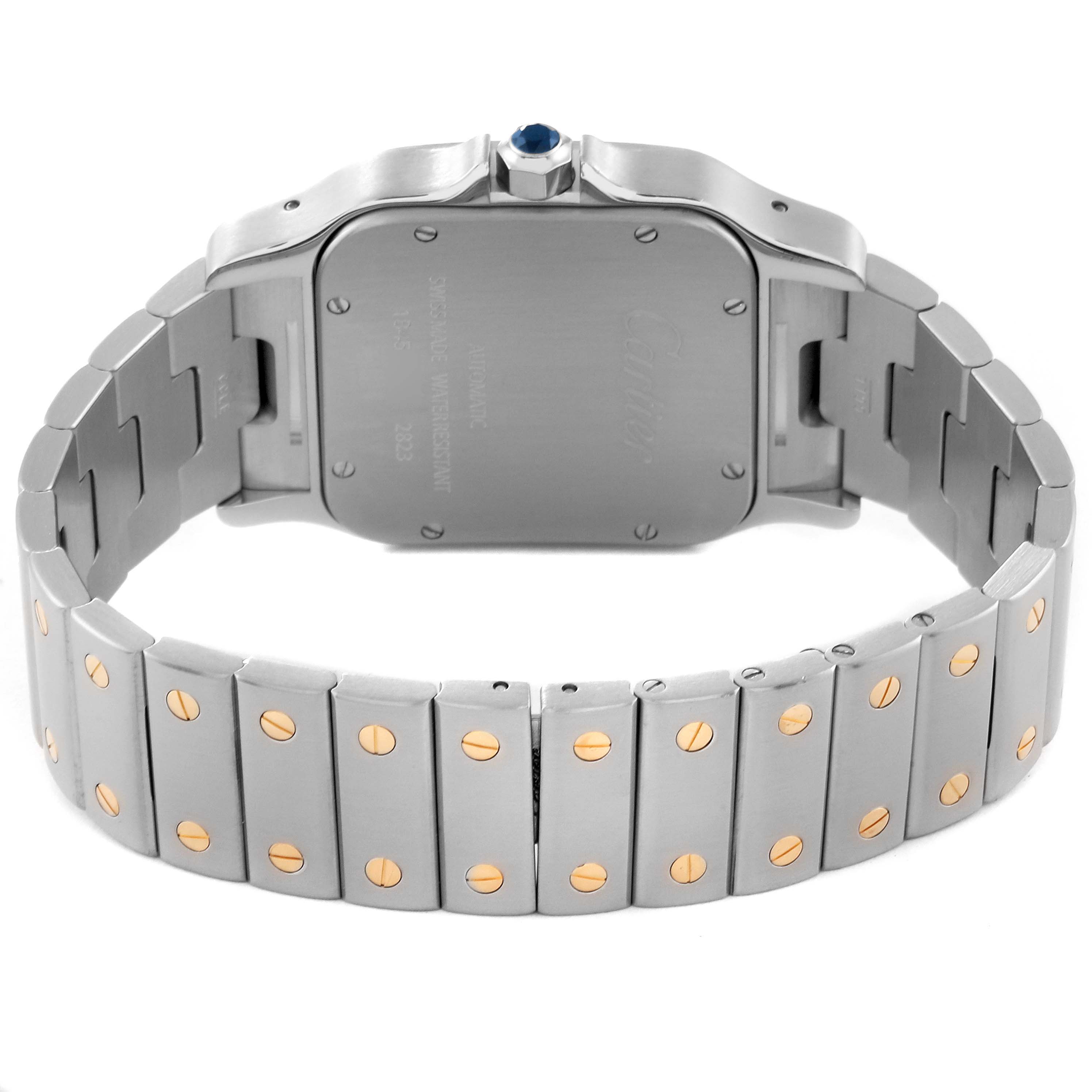 The image shows the Santos model by Cartier from the back, highlighting its case and metal bracelet with gold screws.