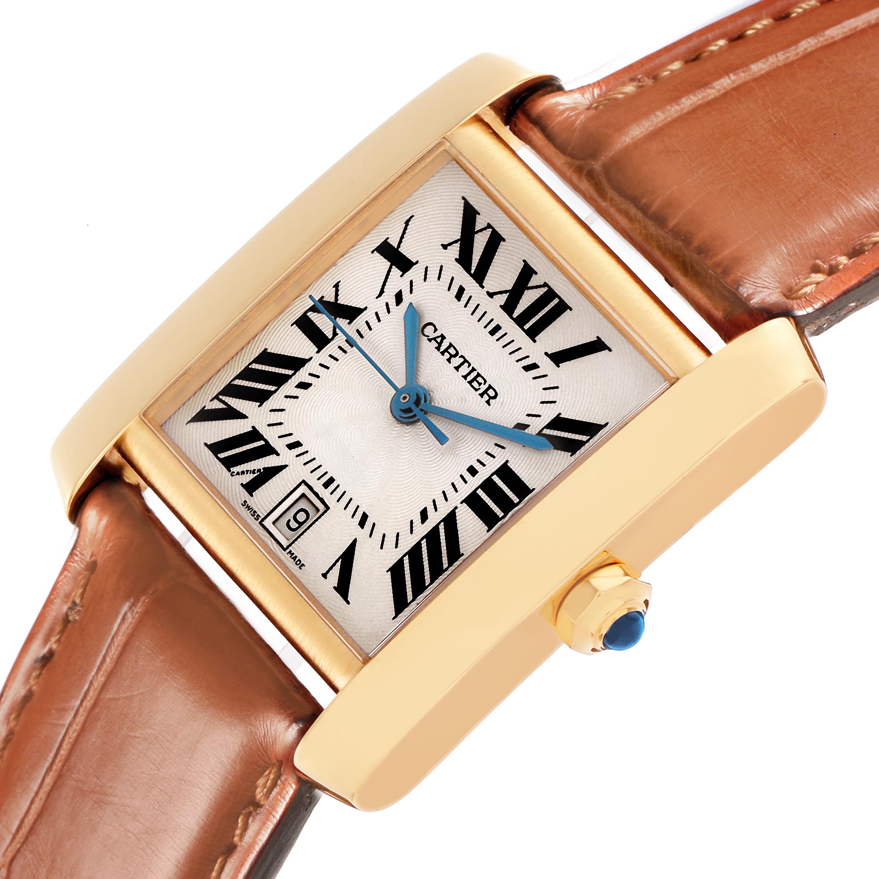 The image shows a close-up angled view of the Cartier Tank Francaise W5000156 Men's Yellow Gold Silver Dial W5000156 Men's Yellow Gold Silver Dial watch, highlighting the gold case, Roman numeral dial, and brown leather strap.
