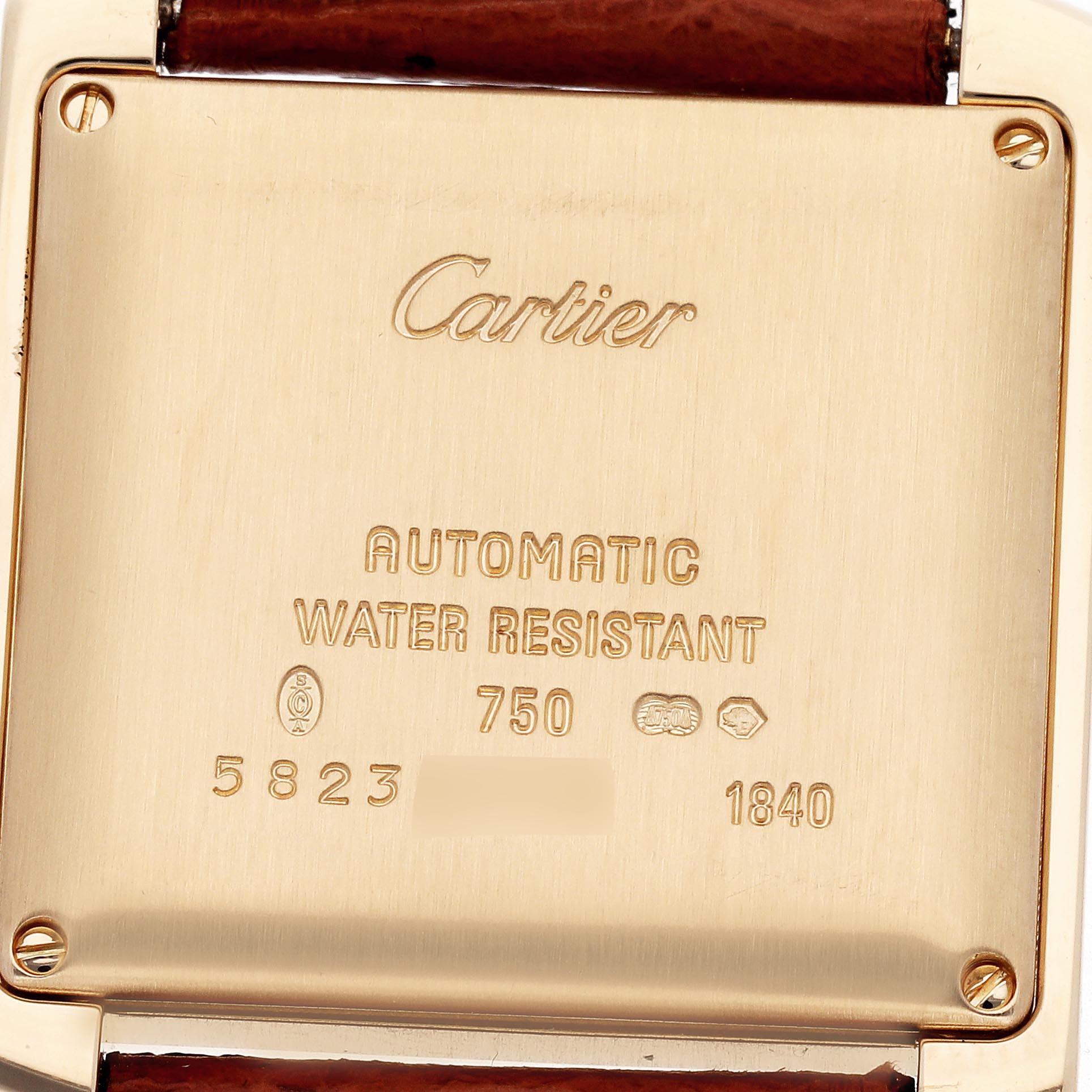 The image shows the back case of a Cartier Tank Française watch, highlighting its engravings and water resistance markings.