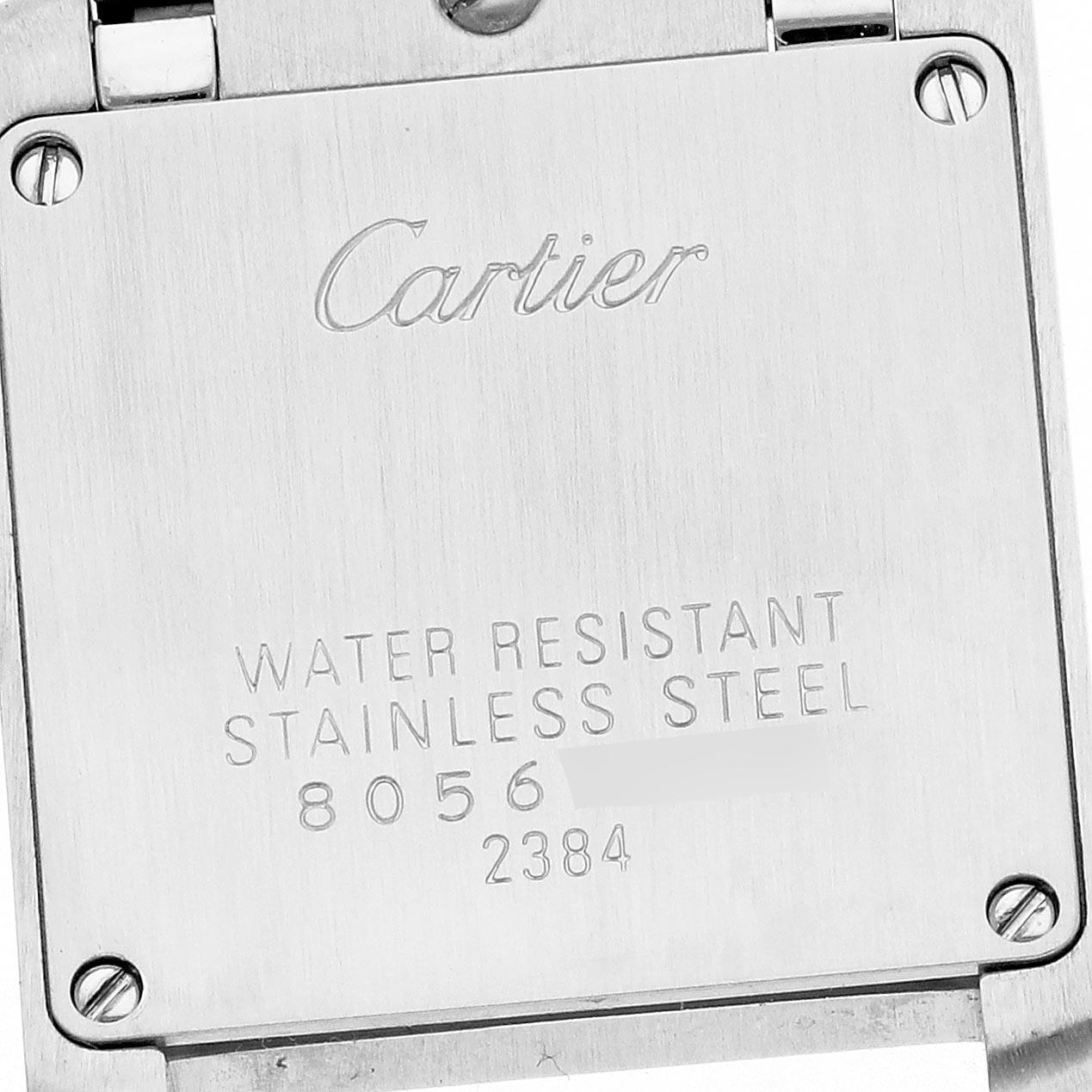 The image shows the back case of a Cartier Tank Francaise W51027Q4 Women's Steel and Gold (two tone) Mother of Pearl Dial W51027Q4 Women's Steel and Gold (two tone) Mother of Pearl Dial watch, featuring engravings and screws.