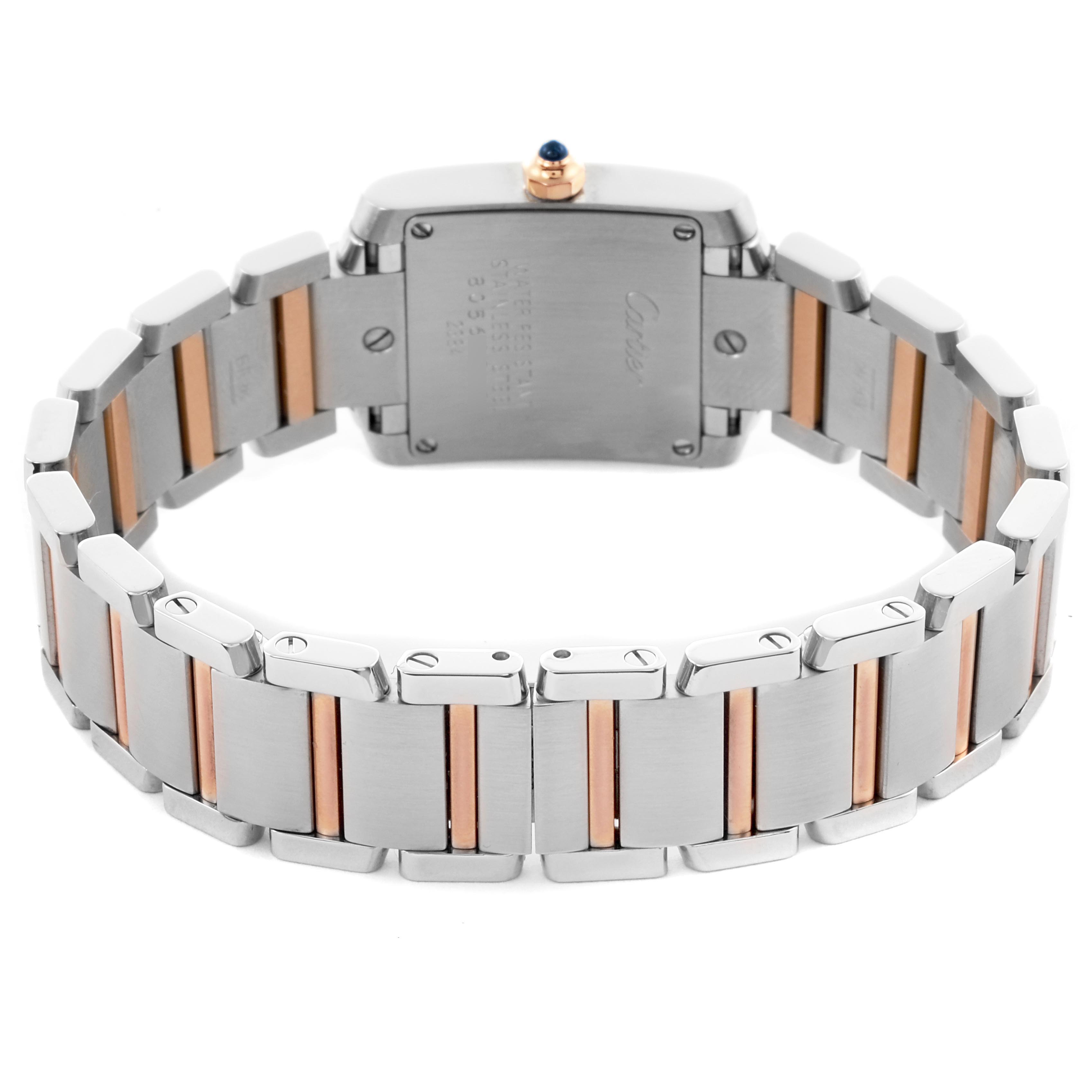 The image shows the back view of a Cartier Tank Française watch, highlighting its metal and rose gold bracelet and case back.