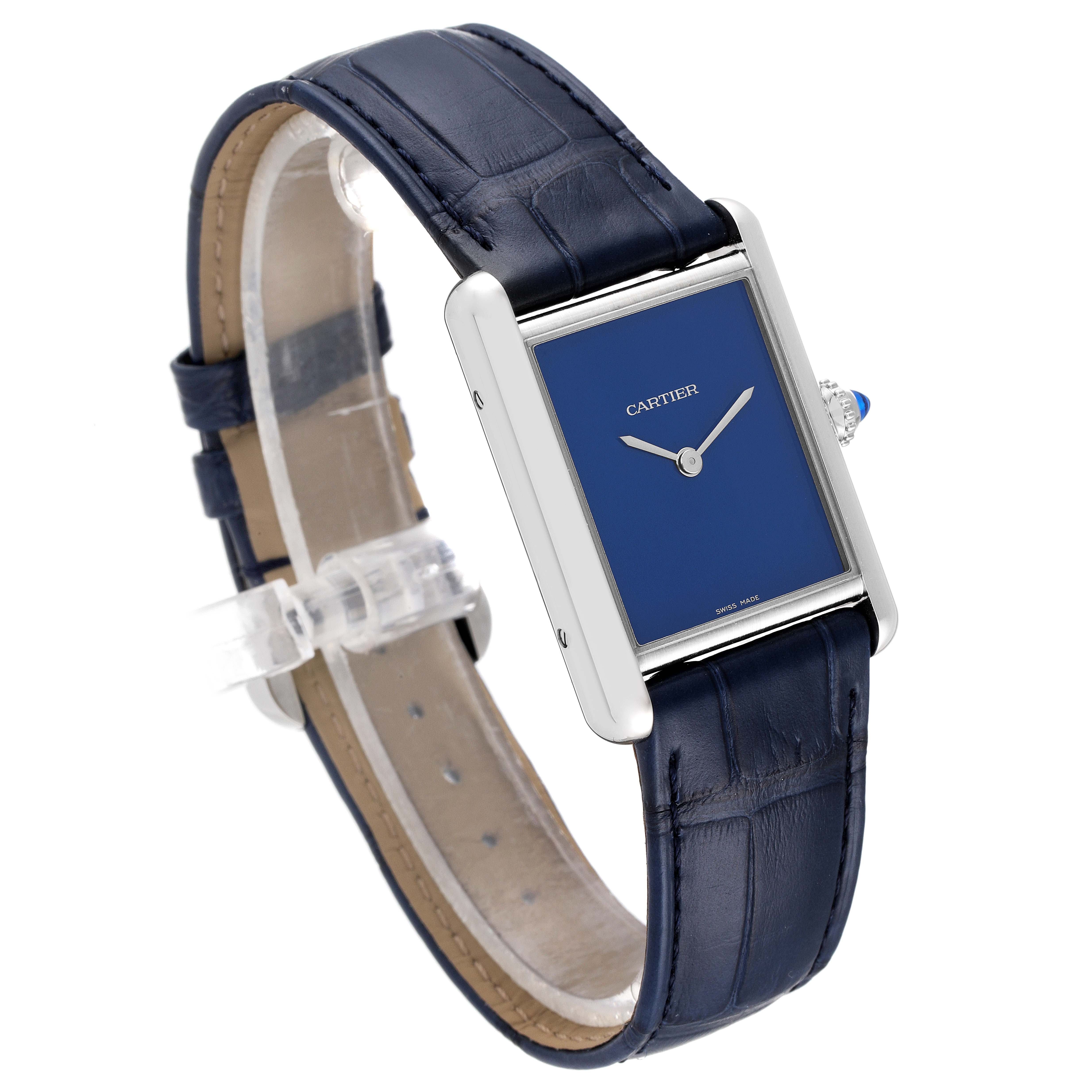 The image shows a Cartier Tank Must WSTA0055 Women's Stainless Steel Blue Dial WSTA0055 Women's Stainless Steel Blue Dial model watch at a three-quarter angle, highlighting its blue dial and leather strap.