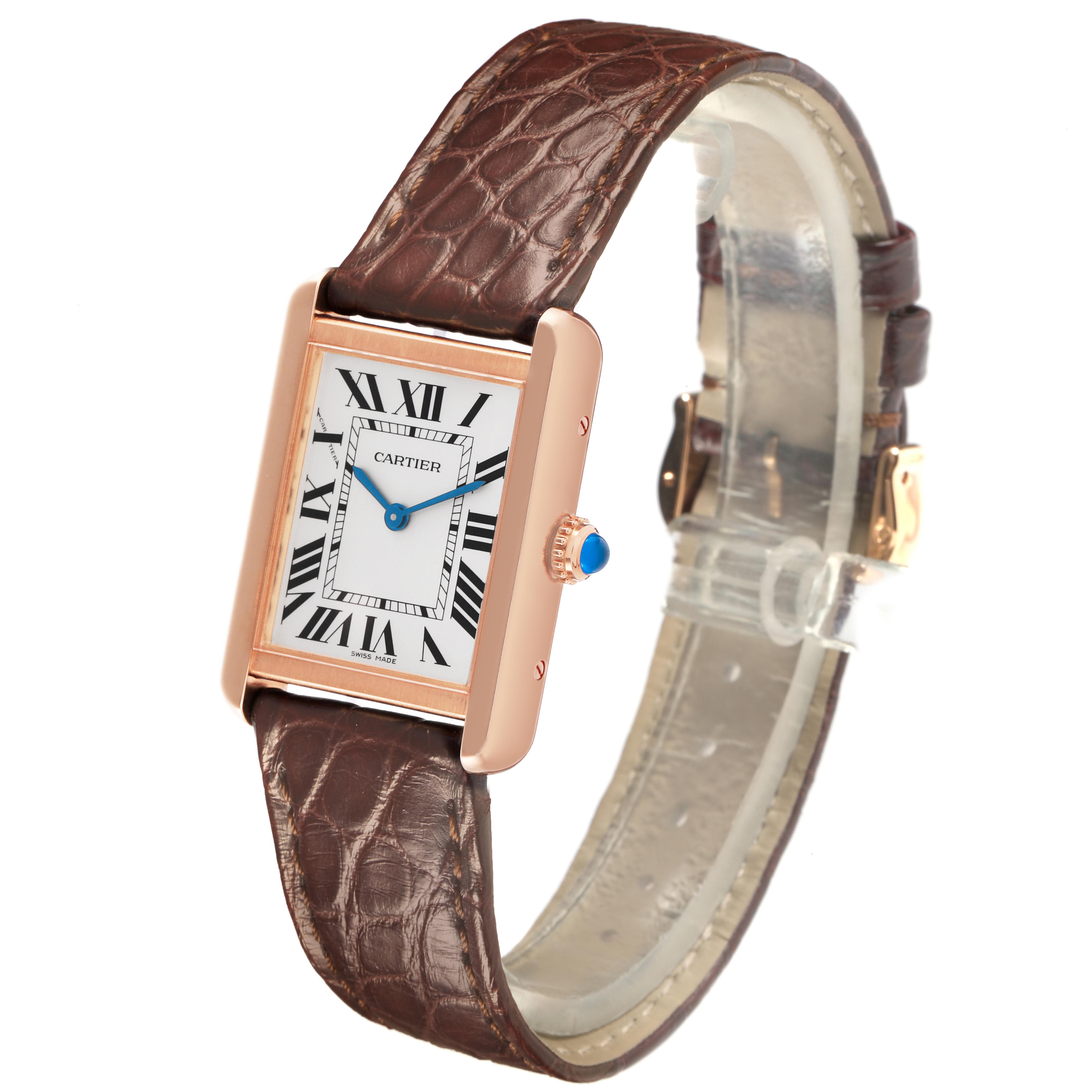The Cartier Tank Solo W5200024 Women's Steel and Gold (two tone) Silver Dial W5200024 Women's Steel and Gold (two tone) Silver Dial watch is shown at a slight angle, highlighting its rectangular face, brown leather strap, and blue crown.