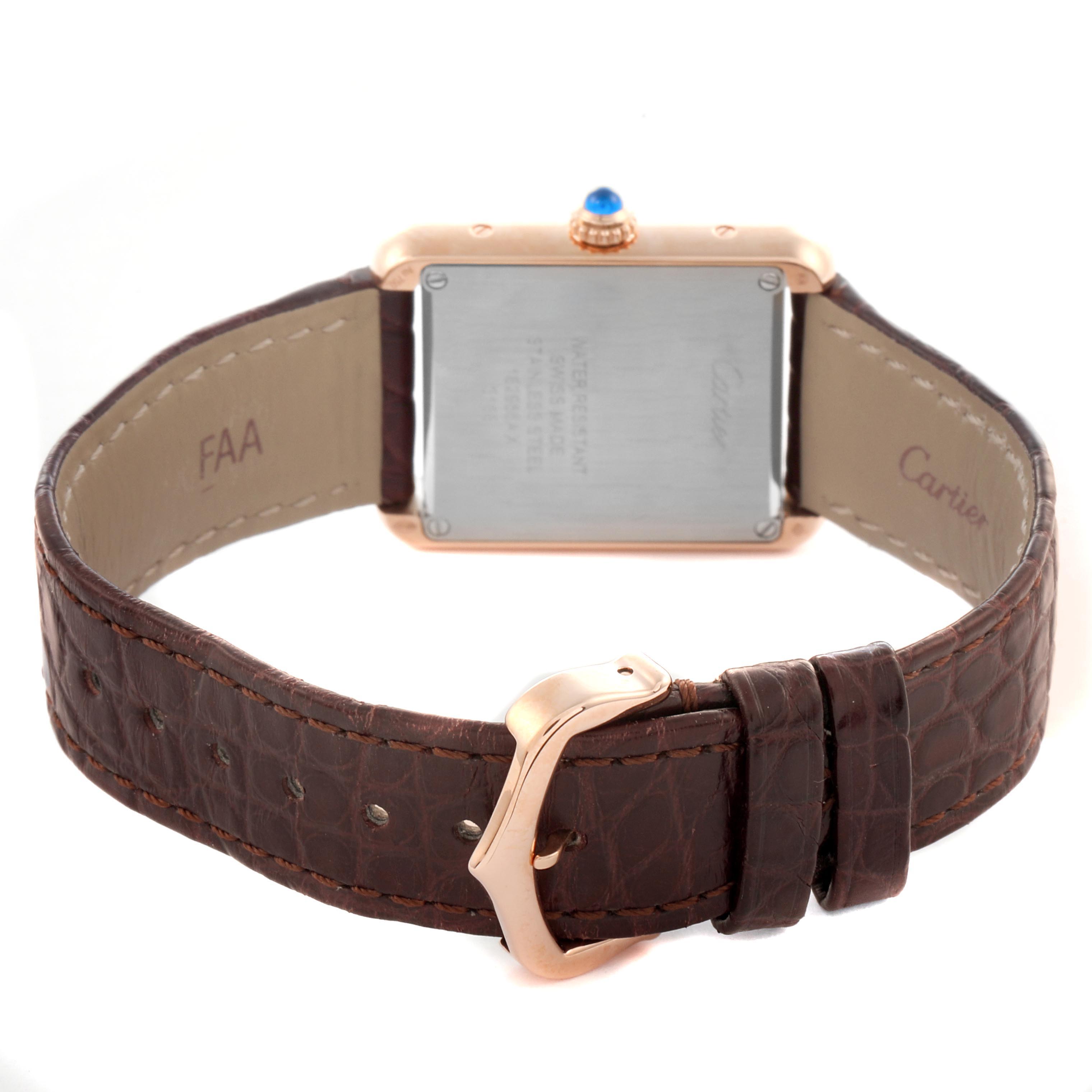 The Cartier Tank Solo W5200024 Women's Steel and Gold (two tone) Silver Dial W5200024 Women's Steel and Gold (two tone) Silver Dial watch is shown from the back, highlighting the case, strap, buckle, and crown with a blue cabochon.