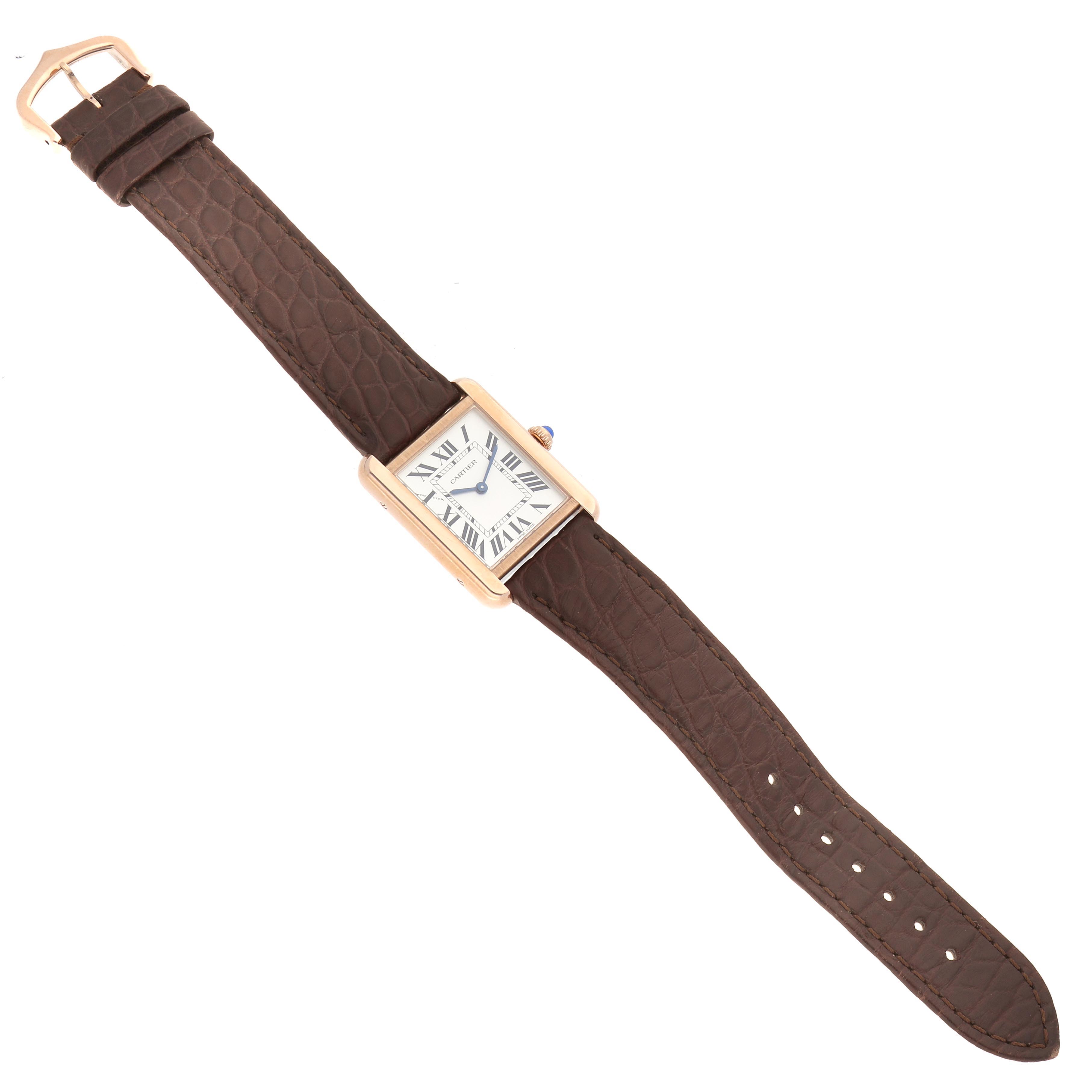 The Cartier Tank Solo W5200024 Women's Steel and Gold (two tone) Silver Dial W5200024 Women's Steel and Gold (two tone) Silver Dial watch is shown from an overhead angle, displaying the full brown leather strap and rectangular face.
