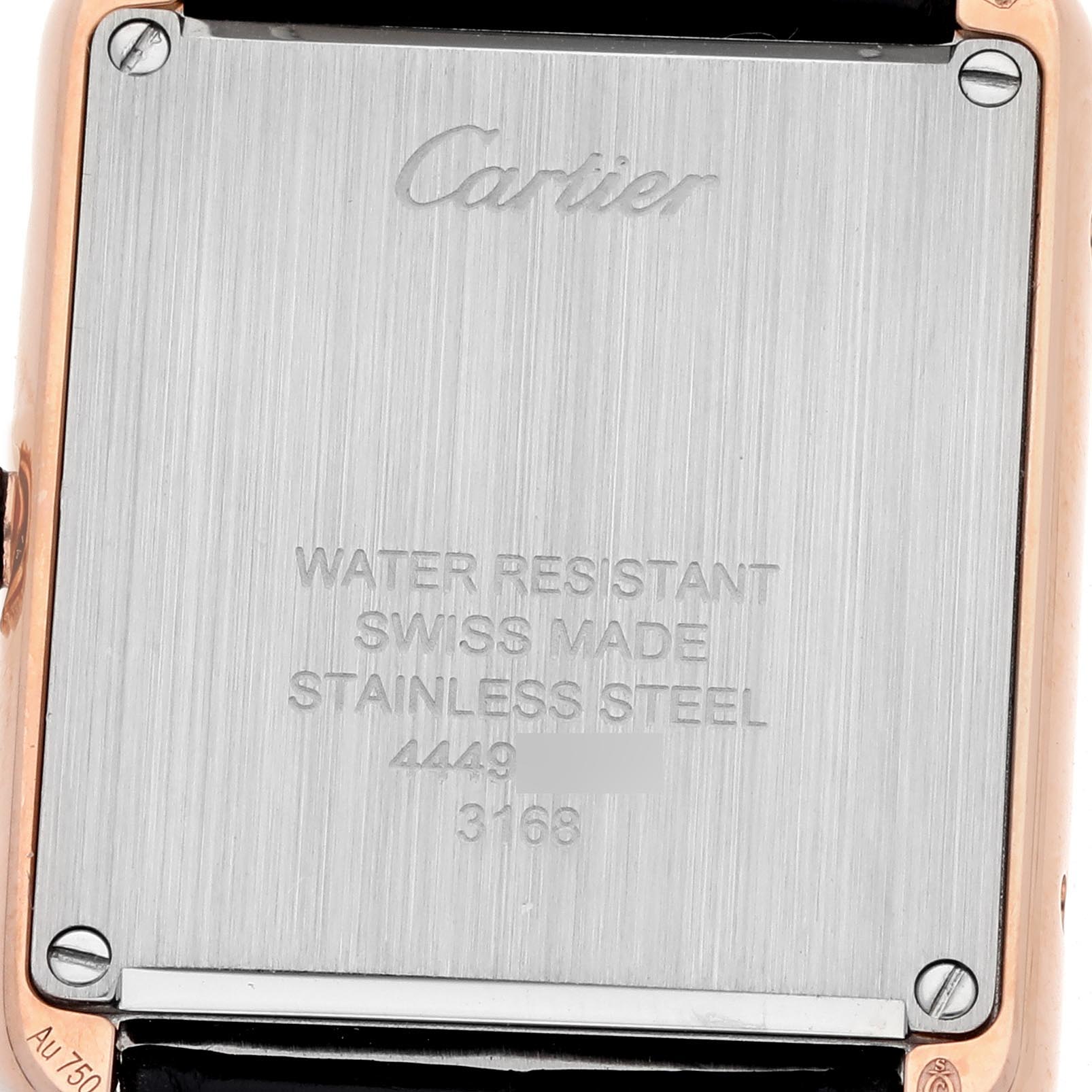 The image shows the back plate of a Cartier Tank Solo W5200024 Women's Steel and Gold (two tone) Silver Dial W5200024 Women's Steel and Gold (two tone) Silver Dial watch, featuring branding and specifications.