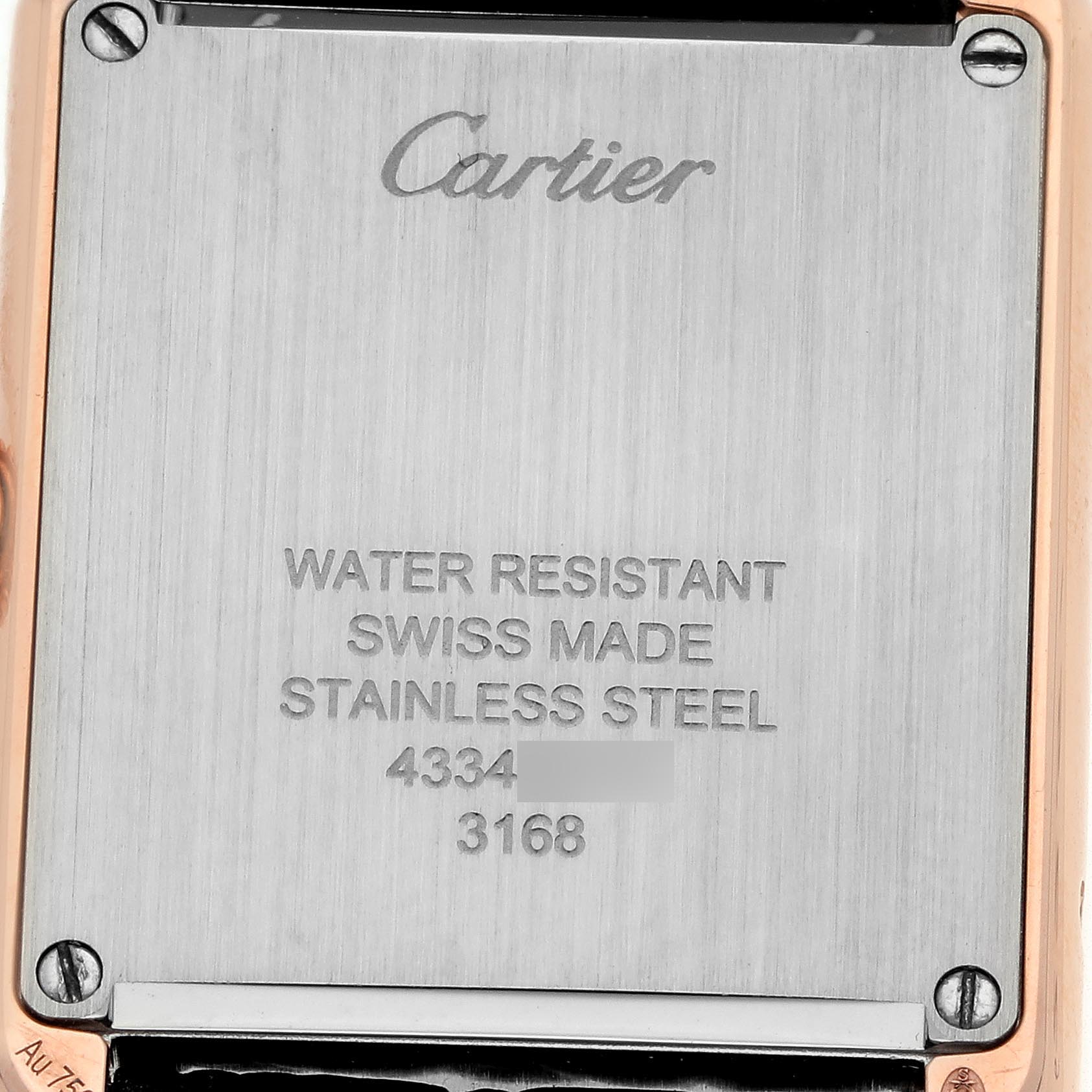 The image shows the back of a Cartier Tank Solo W5200024 Women's Rose Gold Silver Dial W5200024 Women's Rose Gold Silver Dial watch, highlighting its stainless steel casing and engraved details.