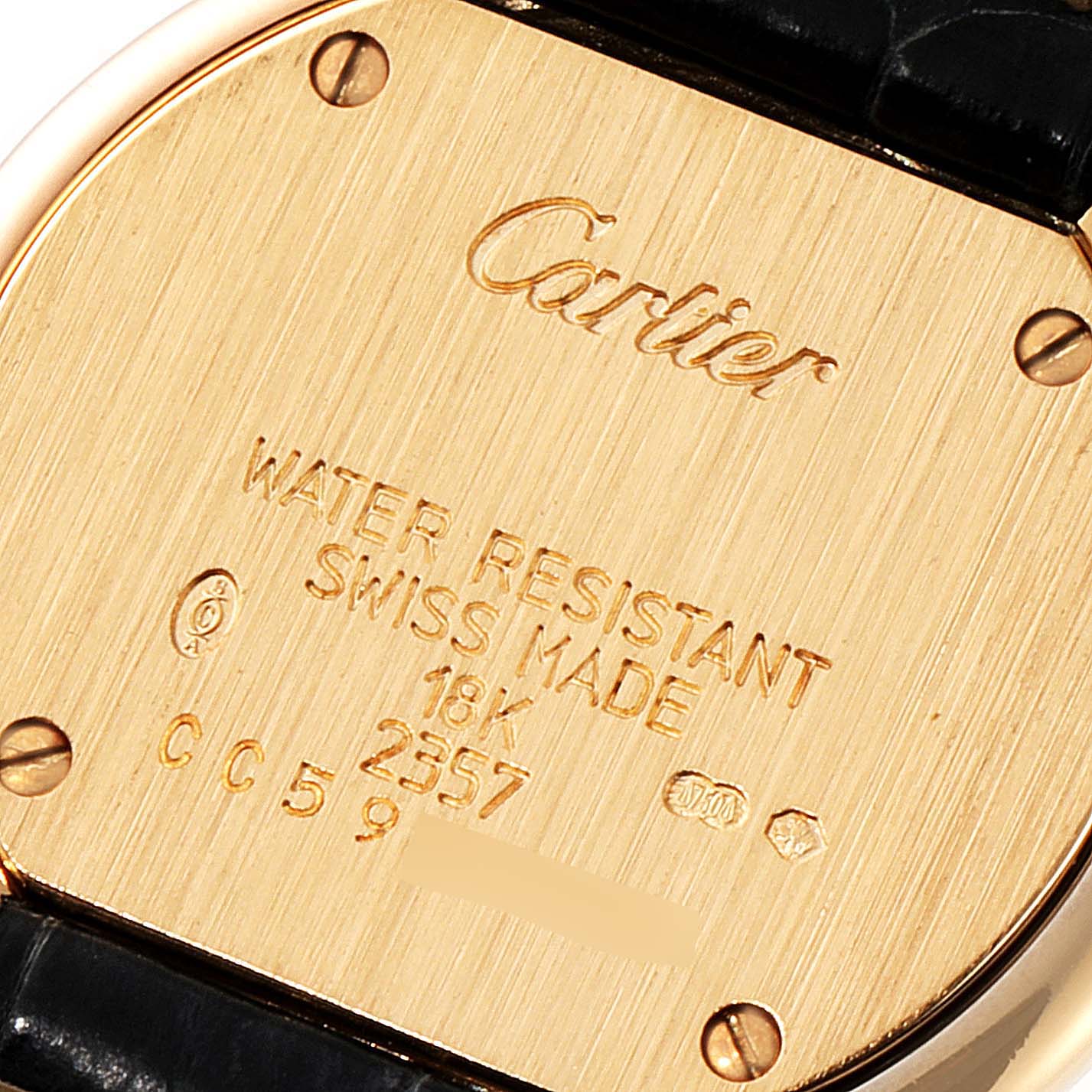 The image shows the back of the Cartier Trinity W200246 Women's Yellow Gold Beige Dial W200246 Women's Yellow Gold Beige Dial model watch, highlighting inscriptions and screws.