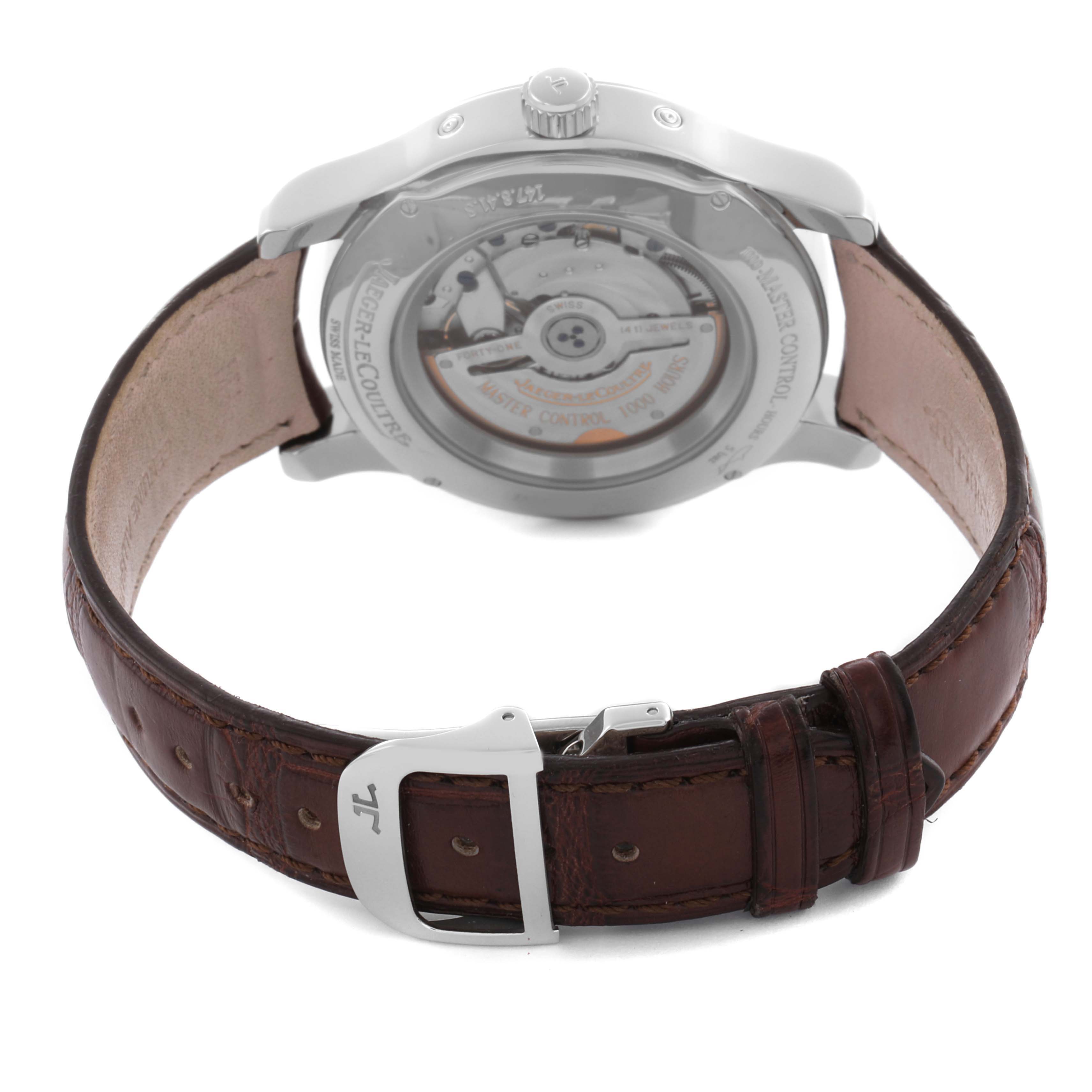 The image shows the back view of a Jaeger-LeCoultre Master watch, highlighting the transparent case back and clasp on the brown leather strap.