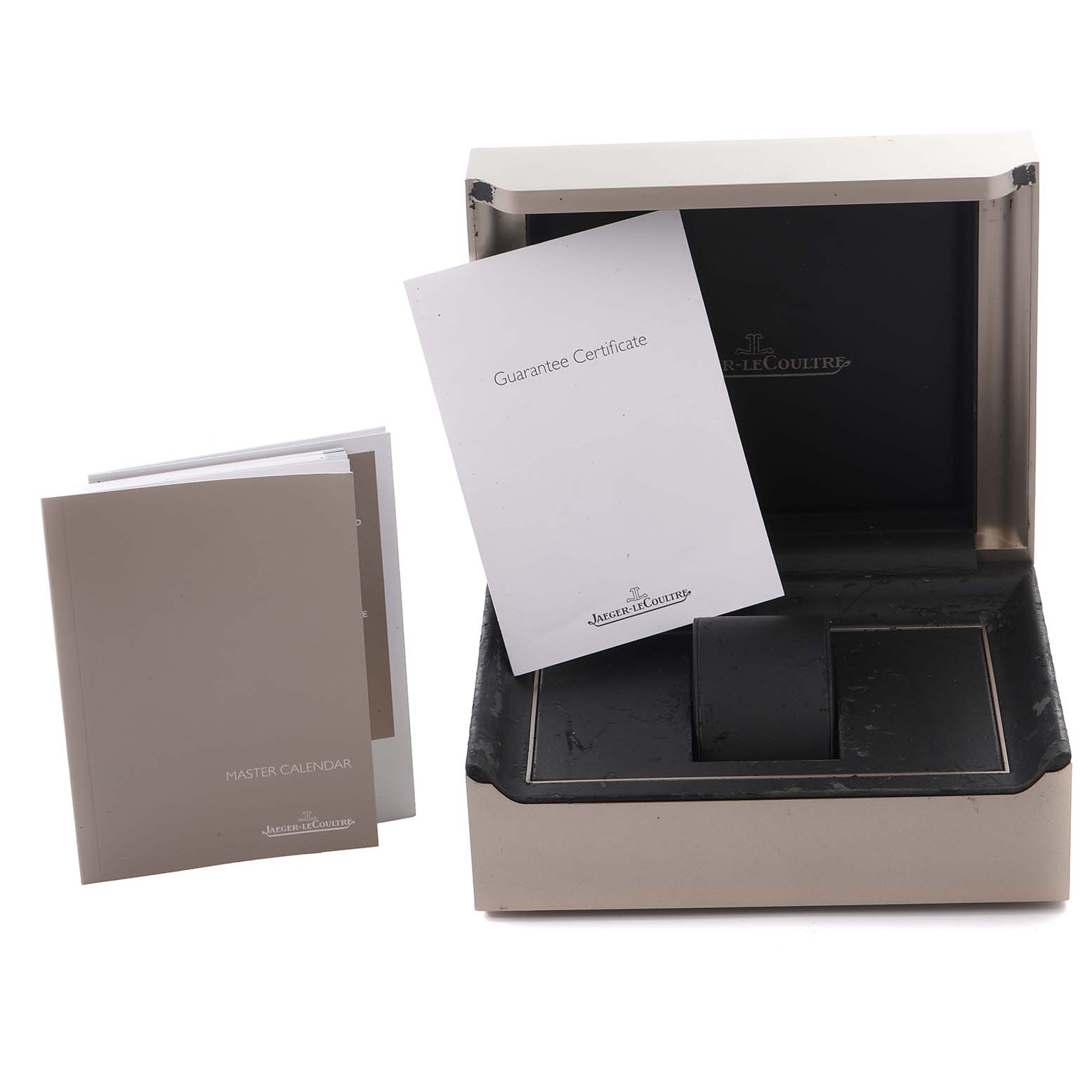 The image shows the packaging and manuals for a Jaeger LeCoultre Master Q151842A Men's Stainless Steel Silver Dial Q151842A Men's Stainless Steel Silver Dial model, including a box and guarantee certificate.