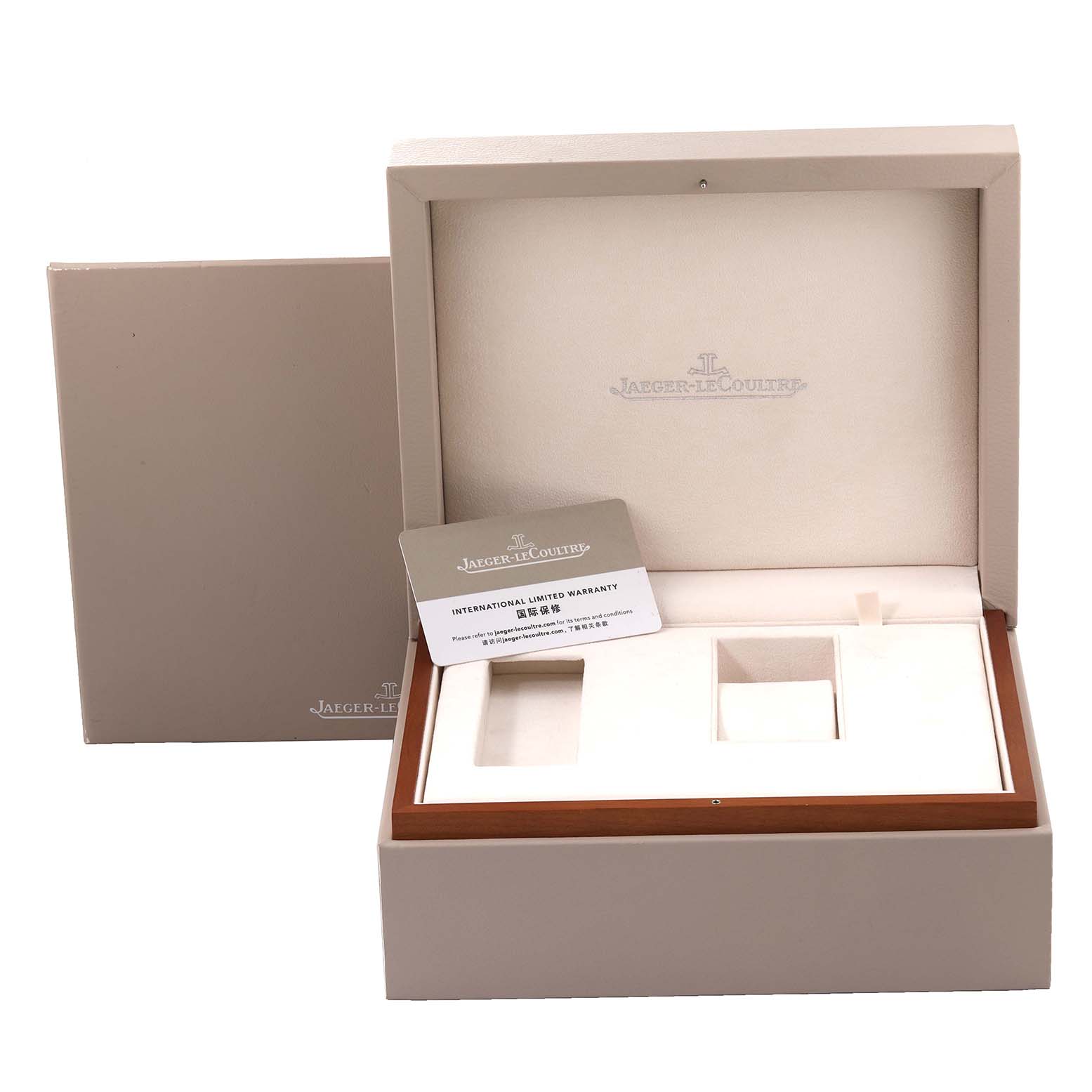 The image shows an open Jaeger LeCoultre Reverso Q398258J Men's Rose Gold Silver Dial Q398258J Men's Rose Gold Silver Dial watch box with a warranty card placed inside.