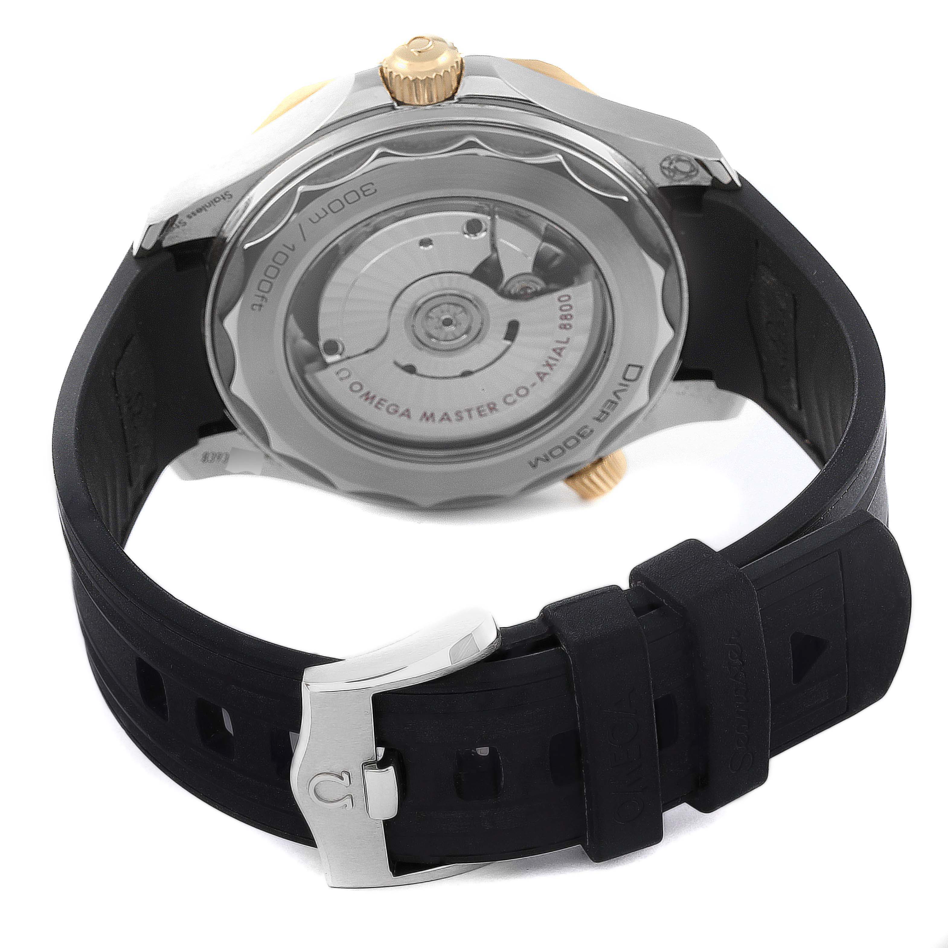 The image shows the back view of an Omega Seamaster 210.22.42.20.01.001 Men's Stainless Steel Black Dial 210.22.42.20.01.001 Men's Stainless Steel Black Dial watch, highlighting its movement, case back, and strap with a clasp.