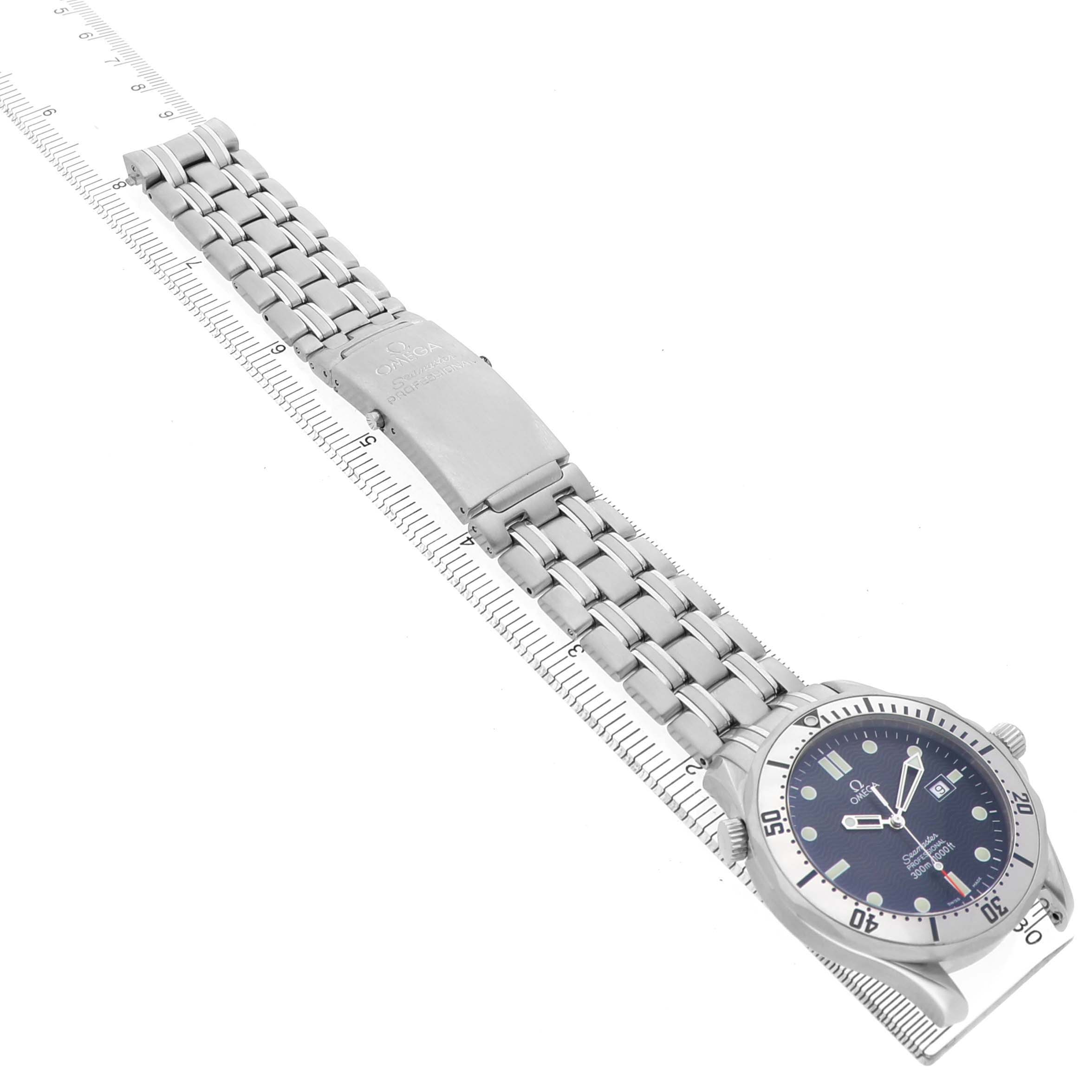 The Omega Seamaster 2542.80.00 Men's Stainless Steel Black Dial is shown from a top angle, displaying the full metal bracelet and face, alongside a ruler.