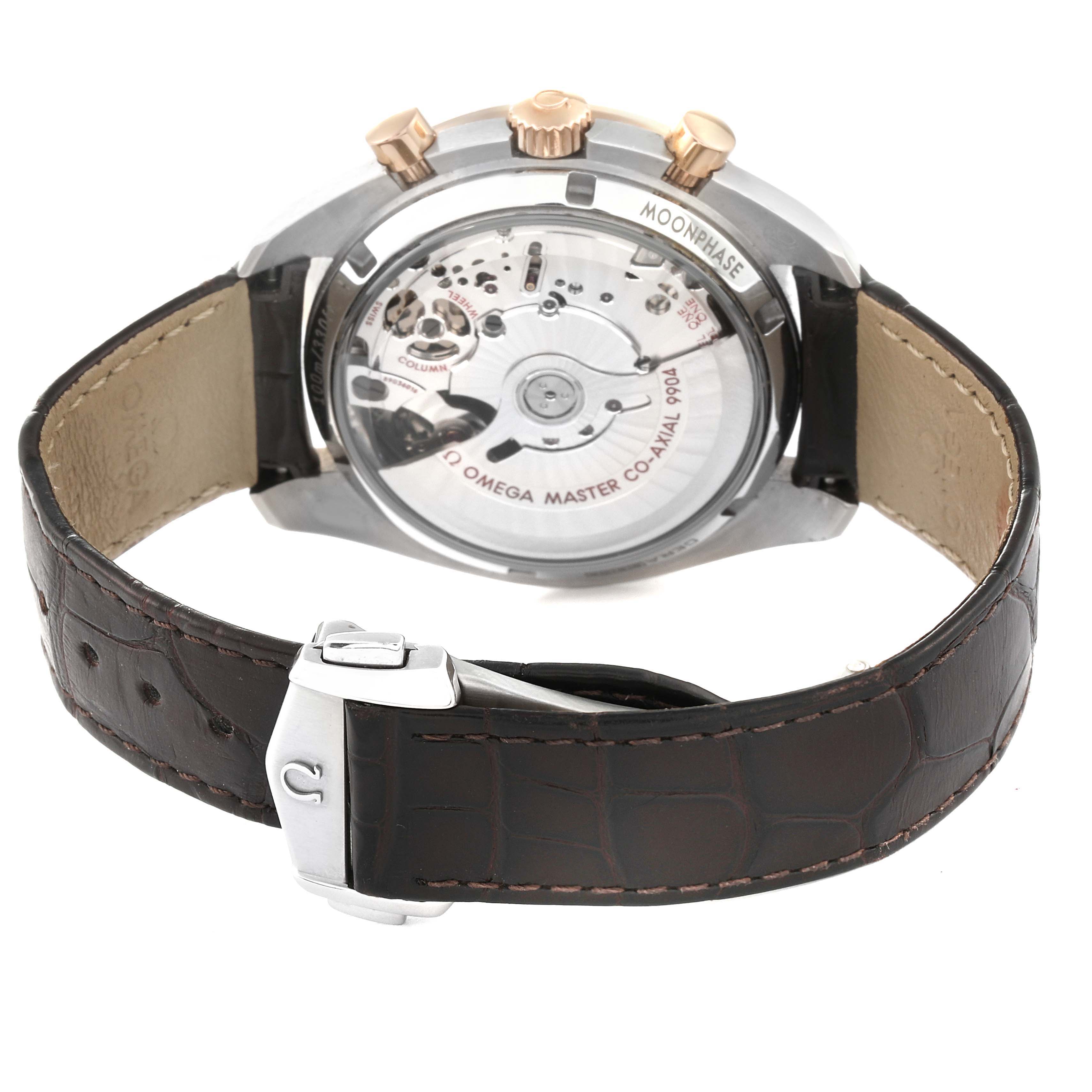 The image shows the back view of an Omega Speedmaster 304.23.44.52.13.001 Men's Stainless Steel Brown Dial 304.23.44.52.13.001 Men's Stainless Steel Brown Dial watch, highlighting its transparent case back and brown leather strap.