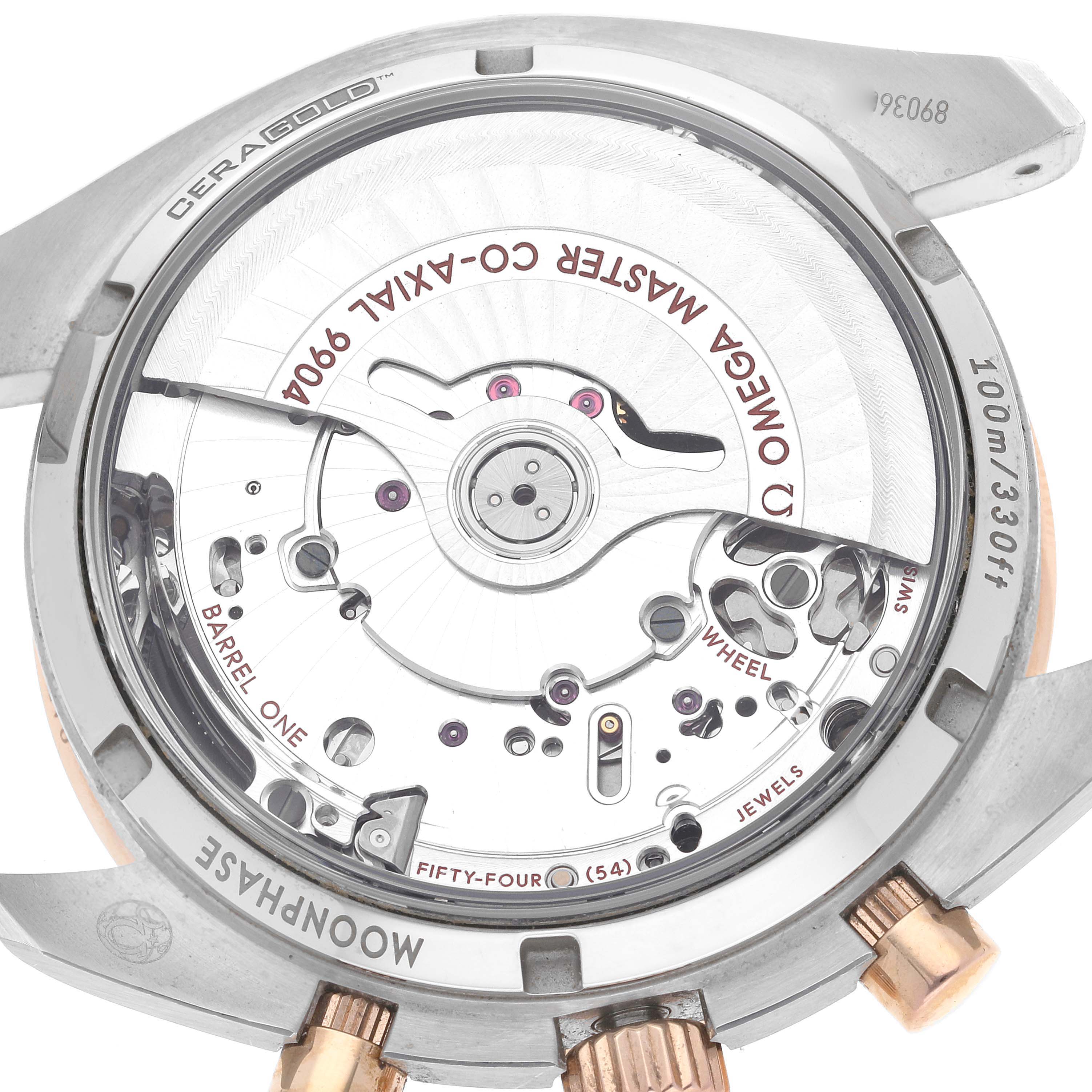 The image shows the backside of an Omega Speedmaster 304.23.44.52.13.001 Men's Stainless Steel Brown Dial 304.23.44.52.13.001 Men's Stainless Steel Brown Dial watch, highlighting the inner workings and mechanisms.