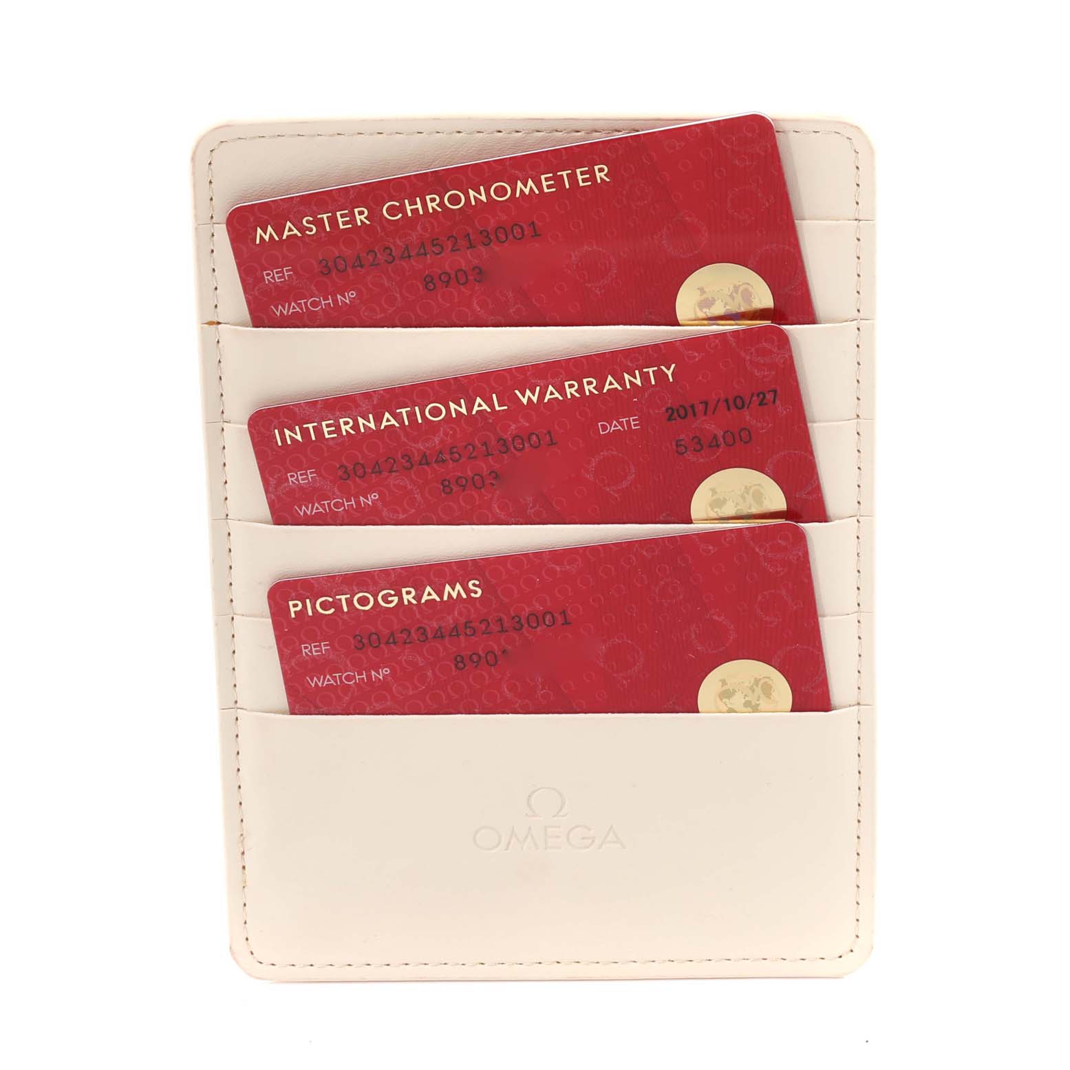 The image shows three red cards in a white Omega wallet, including Master Chronometer, International Warranty, and Pictograms for the Omega Speedmaster 304.23.44.52.13.001 Men's Stainless Steel Brown Dial 304.23.44.52.13.001 Men's Stainless Steel Brown Dial.