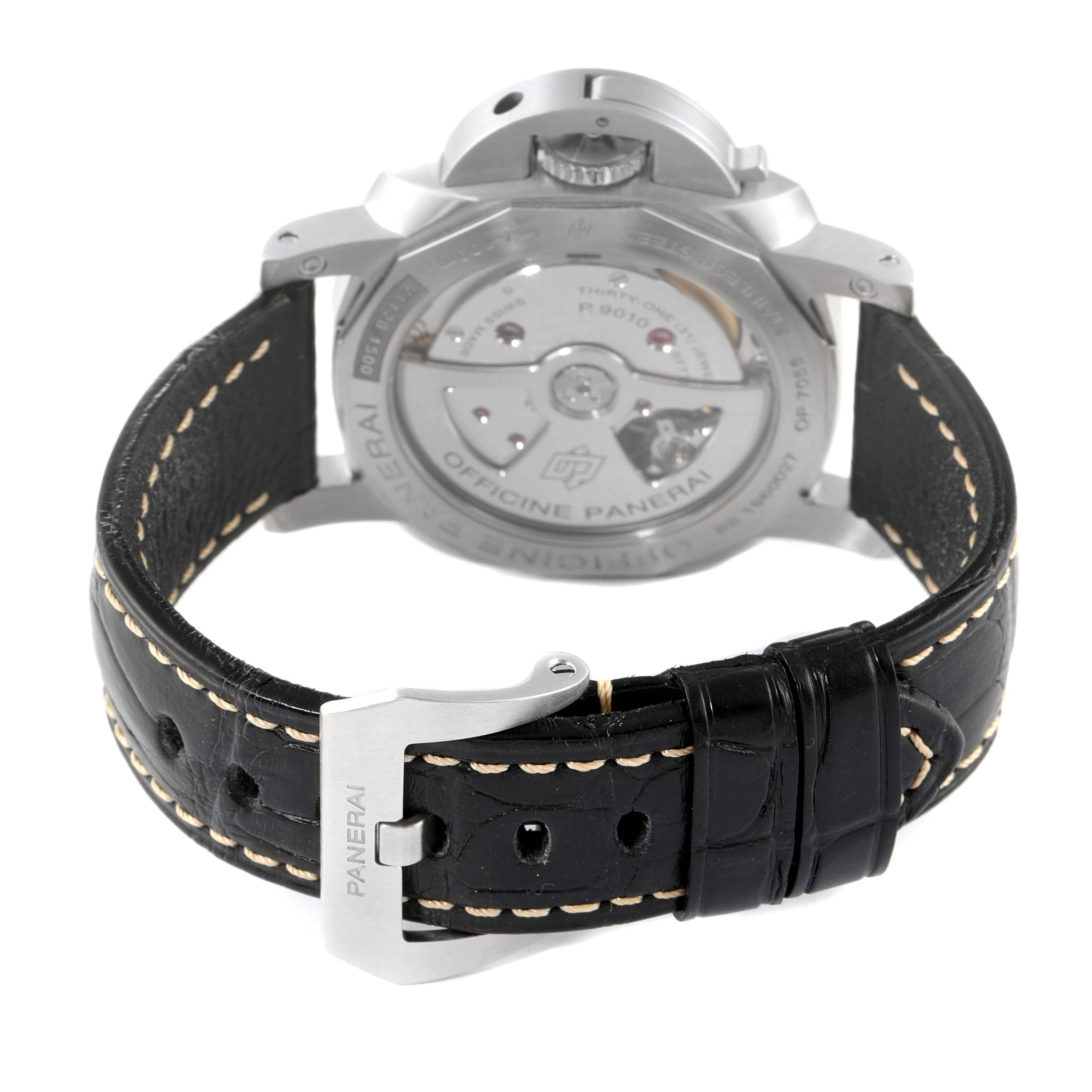 The image shows the back view of a Panerai Luminor PAM01392 Men
s Stainless Steel Black Dial PAM01392 Men
s Stainless Steel Black Dial watch, focusing on its movement and leather strap with a buckle.