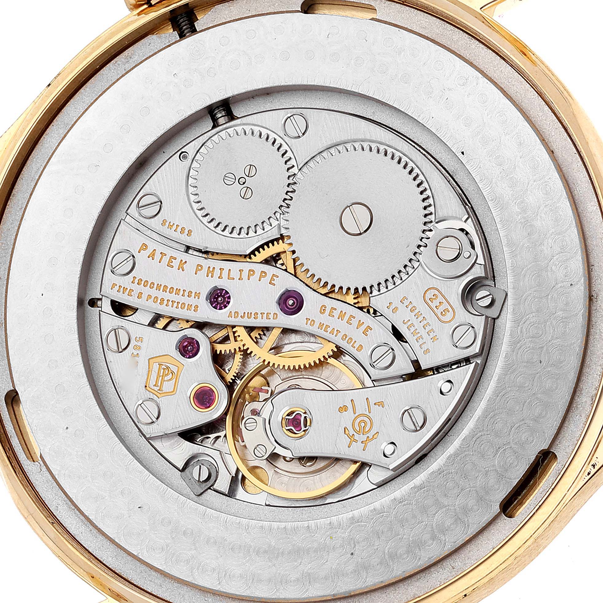 This image shows the intricate movement and internal mechanism of a Patek Philippe Calatrava 5196J Men's Yellow Gold Silver Dial 5196J Men's Yellow Gold Silver Dial watch from a rear angle.
