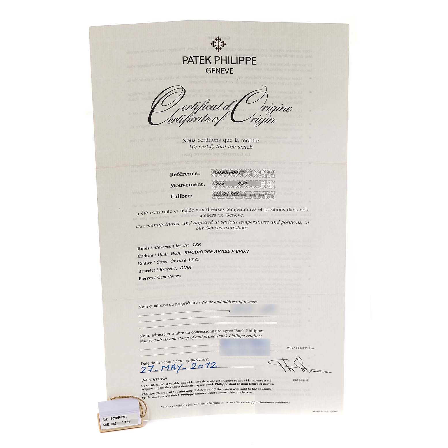 The image shows the Certificate of Origin for the Patek Philippe Gondolo 5098R-001 Men's Rose Gold Silver Dial 5098R-001 Men's Rose Gold Silver Dial watch model, along with a small tag.