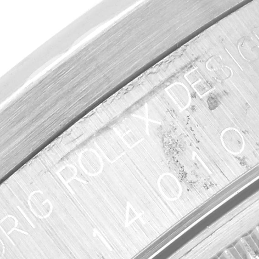 This image shows a close-up of the casing edge and engraved Rolex design details on a Rolex Air-King 14010 Men's Stainless Steel Grey Dial 14010 Men's Stainless Steel Grey Dial watch.