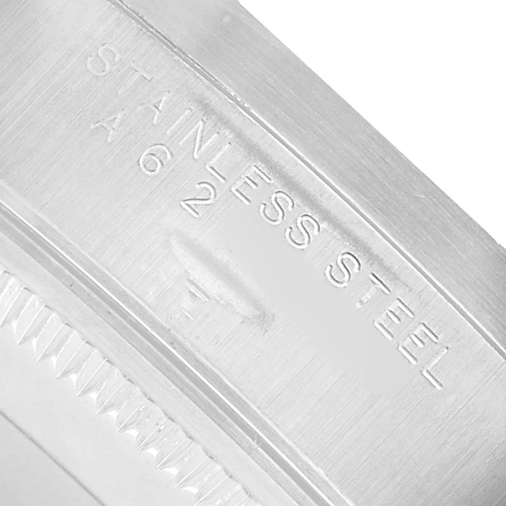 The image shows a close-up of the side of a Rolex Air-King 14010 Men's Stainless Steel Silver Dial, highlighting the "STAINLESS STEEL" engraving.