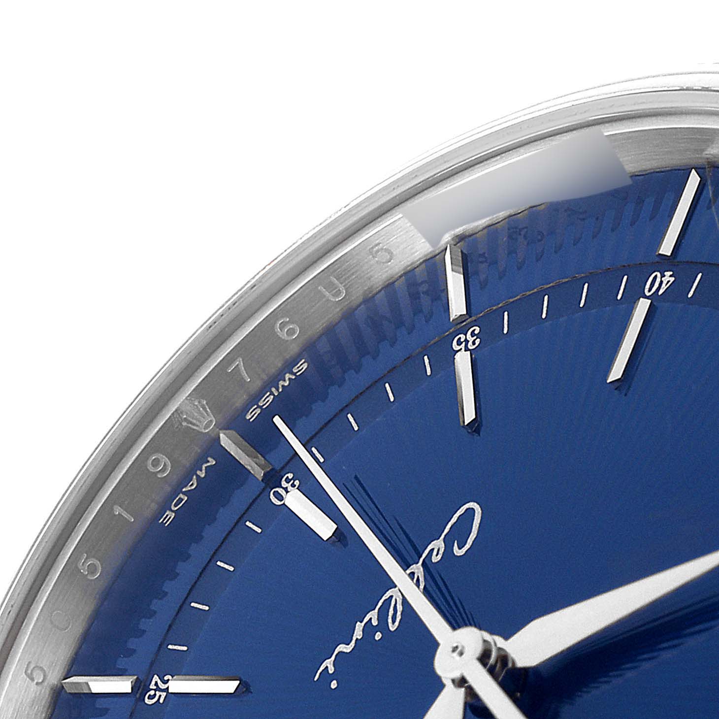 This close-up shot of the Rolex Cellini 50519 Men
s White Gold Blue Dial 50519 Men
s White Gold Blue Dial watch focuses on its blue dial and part of the minute and hour hands.