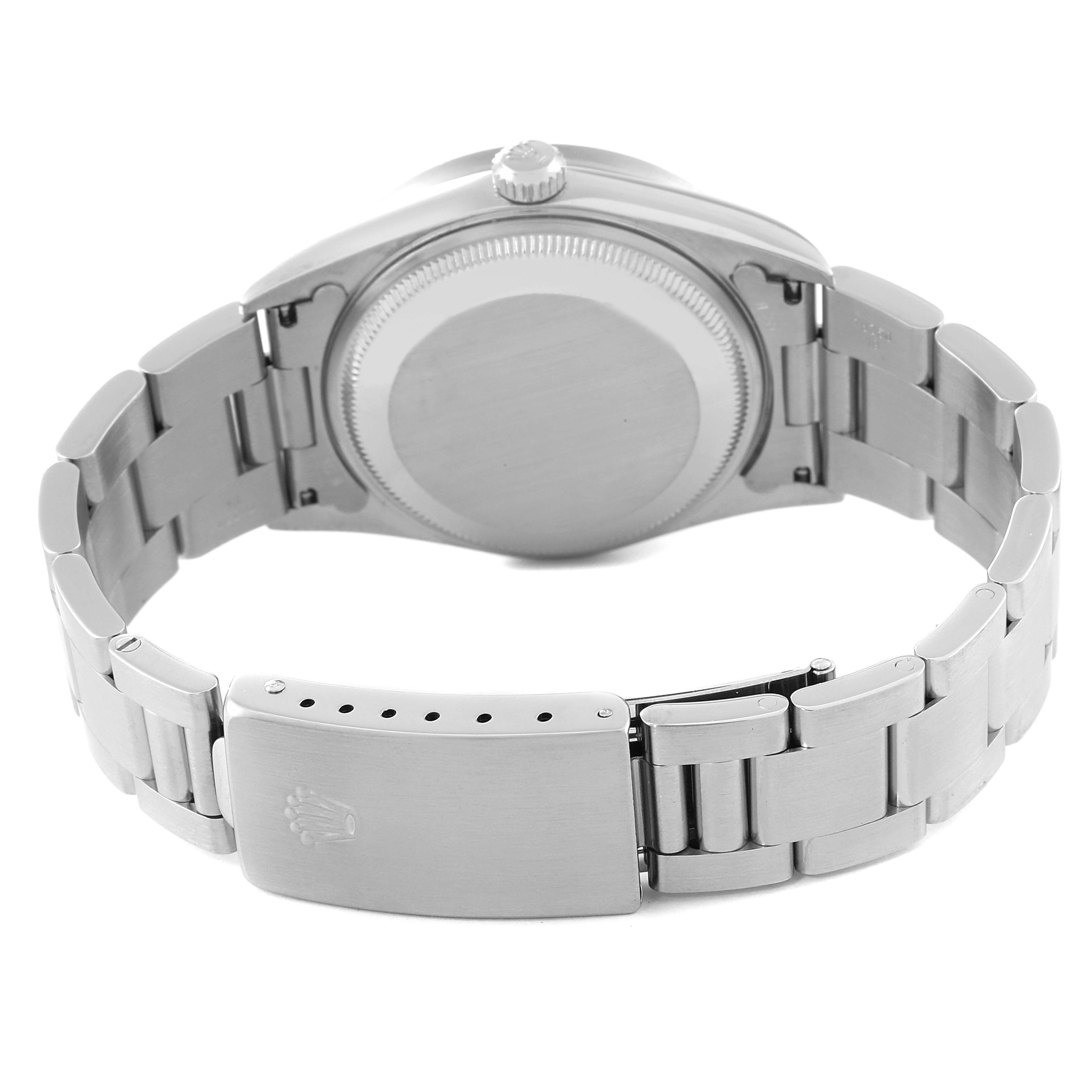 The image shows the back view of a Rolex Date 15210 Men's Stainless Steel Black Dial 15210 Men's Stainless Steel Black Dial model watch, highlighting the case back and stainless steel bracelet with clasp.