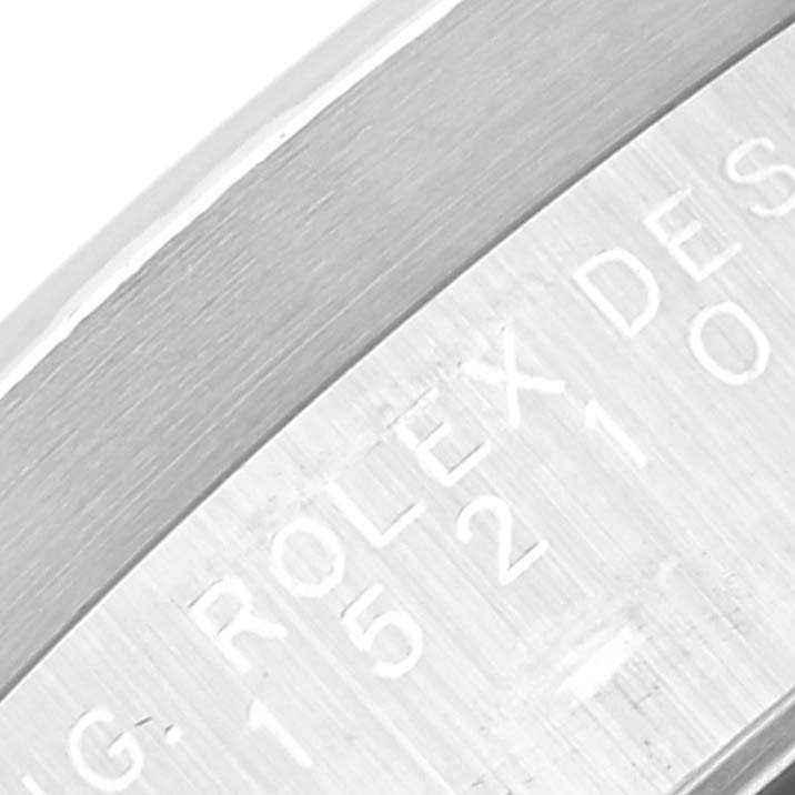 The image shows a close-up angle of the side engraving on a Rolex Date 15210 Men's Stainless Steel Blue Dial 15210 Men's Stainless Steel Blue Dial model watch bezel or band.