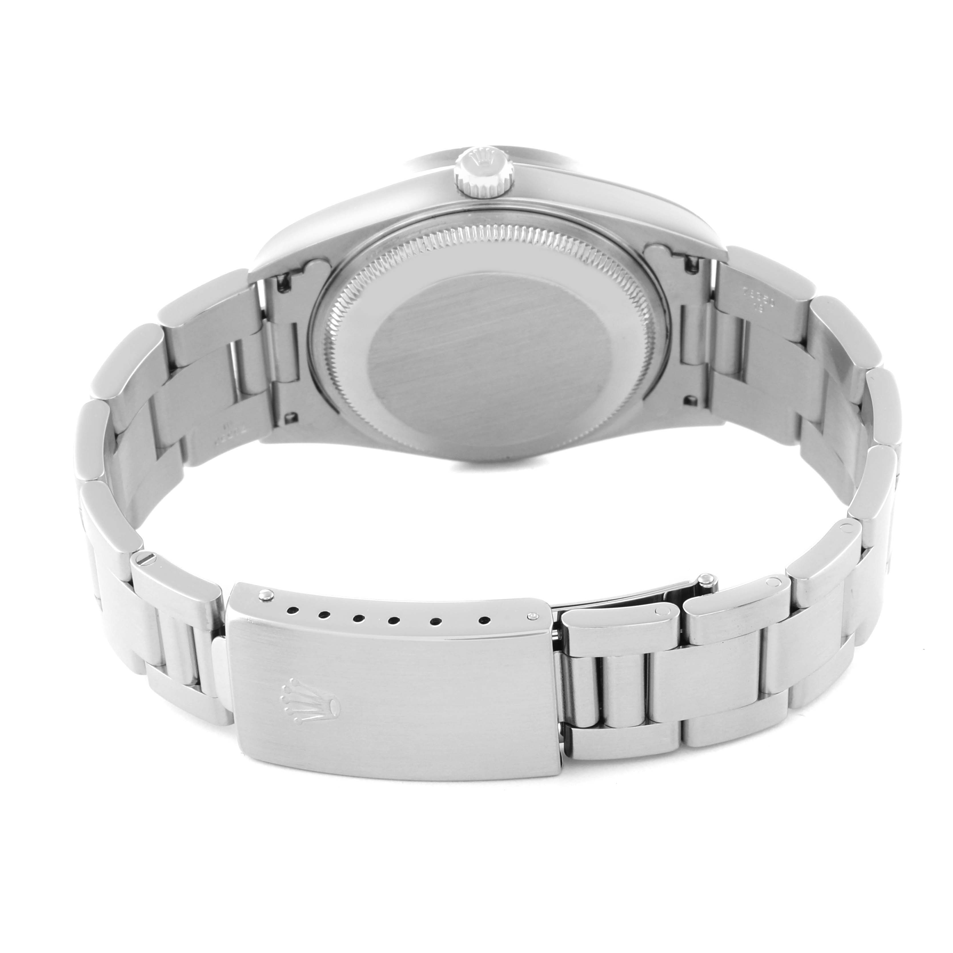 The image shows the back view of a Rolex Date 15210 Men's Stainless Steel Blue Dial 15210 Men's Stainless Steel Blue Dial model watch, highlighting the case back and bracelet clasp.