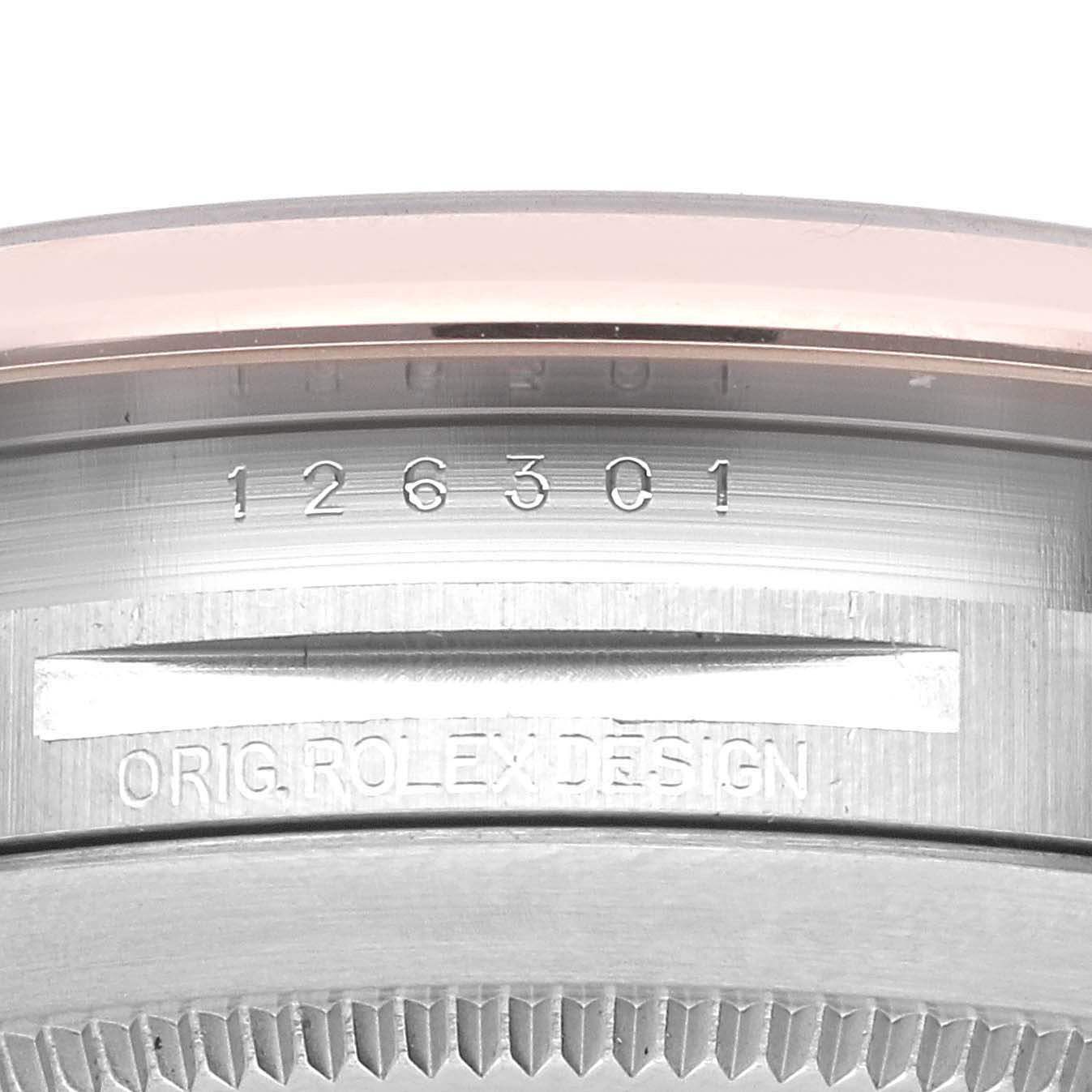 This is a close-up of the case side of a Rolex Datejust 41 126301 Men's Steel and Gold (two tone) Grey Dial 126301 Men's Steel and Gold (two tone) Grey Dial model, showing the model number and "ORIG.ROLEX.DESIGN" engraving.