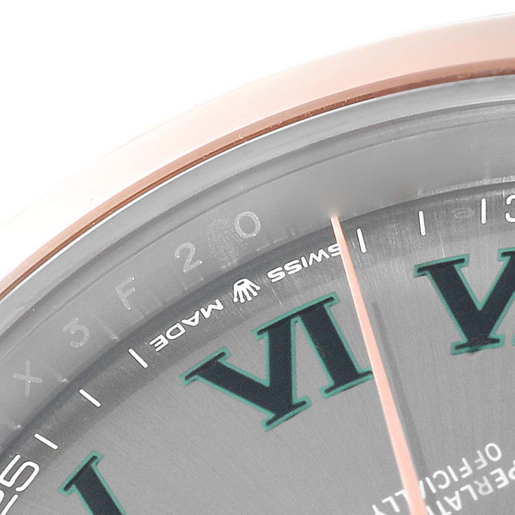 The image shows a close-up of the dial of the Rolex Datejust 41 126301 Men's Steel and Gold (two tone) Grey Dial 126301 Men's Steel and Gold (two tone) Grey Dial, highlighting the Roman numeral VI and the "Swiss Made" text.