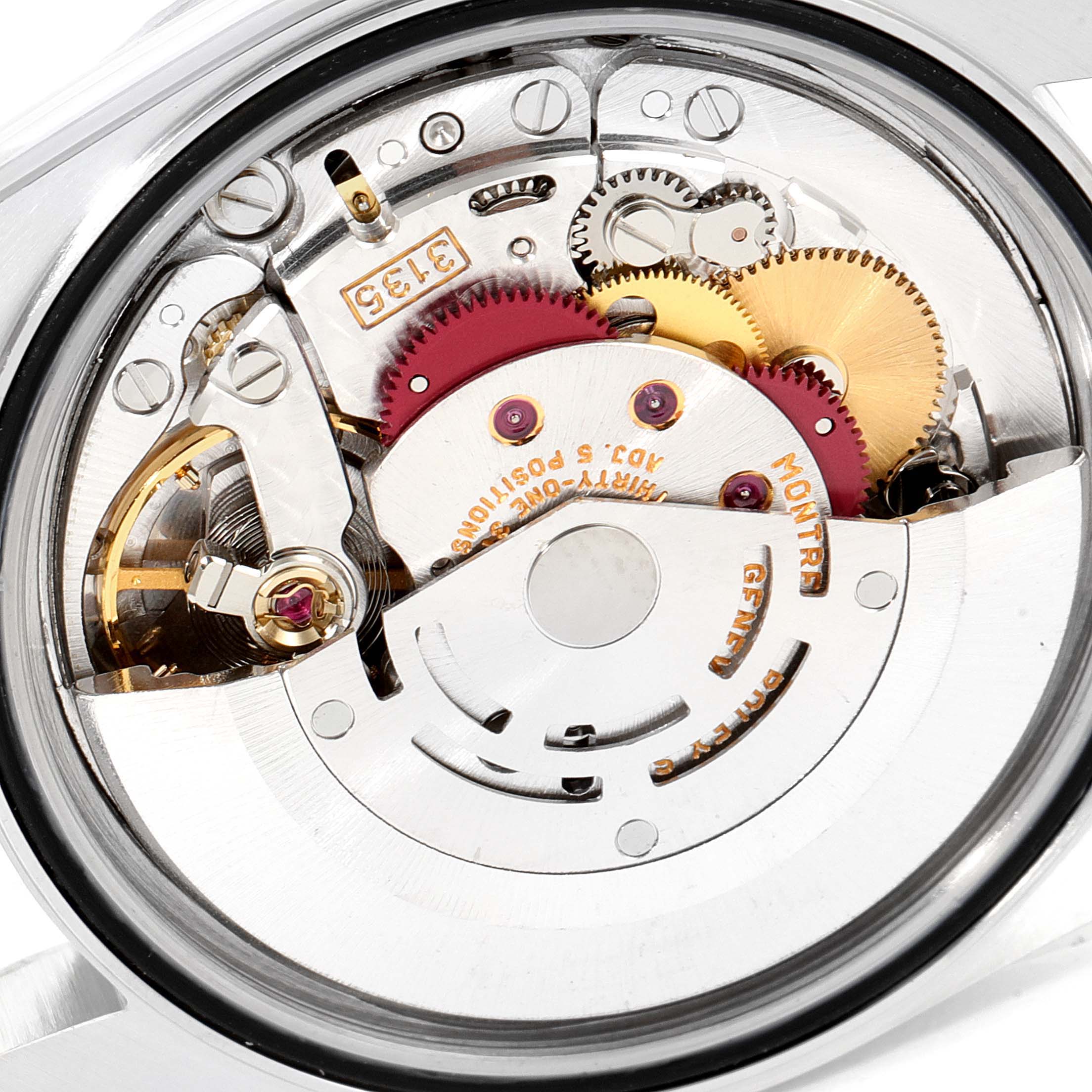 This image shows the intricate internal components and movement of a Rolex Datejust 16220 Men
s Stainless Steel Grey Dial 16220 Men
s Stainless Steel Grey Dial watch from a close-up angle.