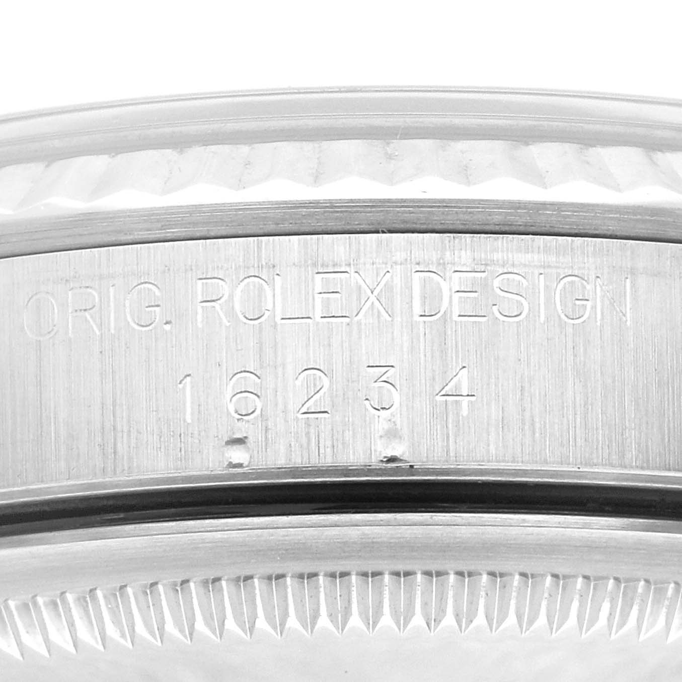 The image shows a close-up angle of the side of a Rolex Datejust 16234 Men's Stainless Steel Blue Dial 16234 Men's Stainless Steel Blue Dial watch case with the engraved model number 16234.