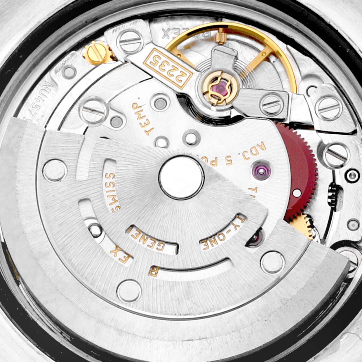 This image shows the Rolex Datejust 179173 Women's Steel and Gold (two tone) Champagne Dial 179173 Women's Steel and Gold (two tone) Champagne Dial watch movement with visible gears, rotor, and other internal components from a back angle.