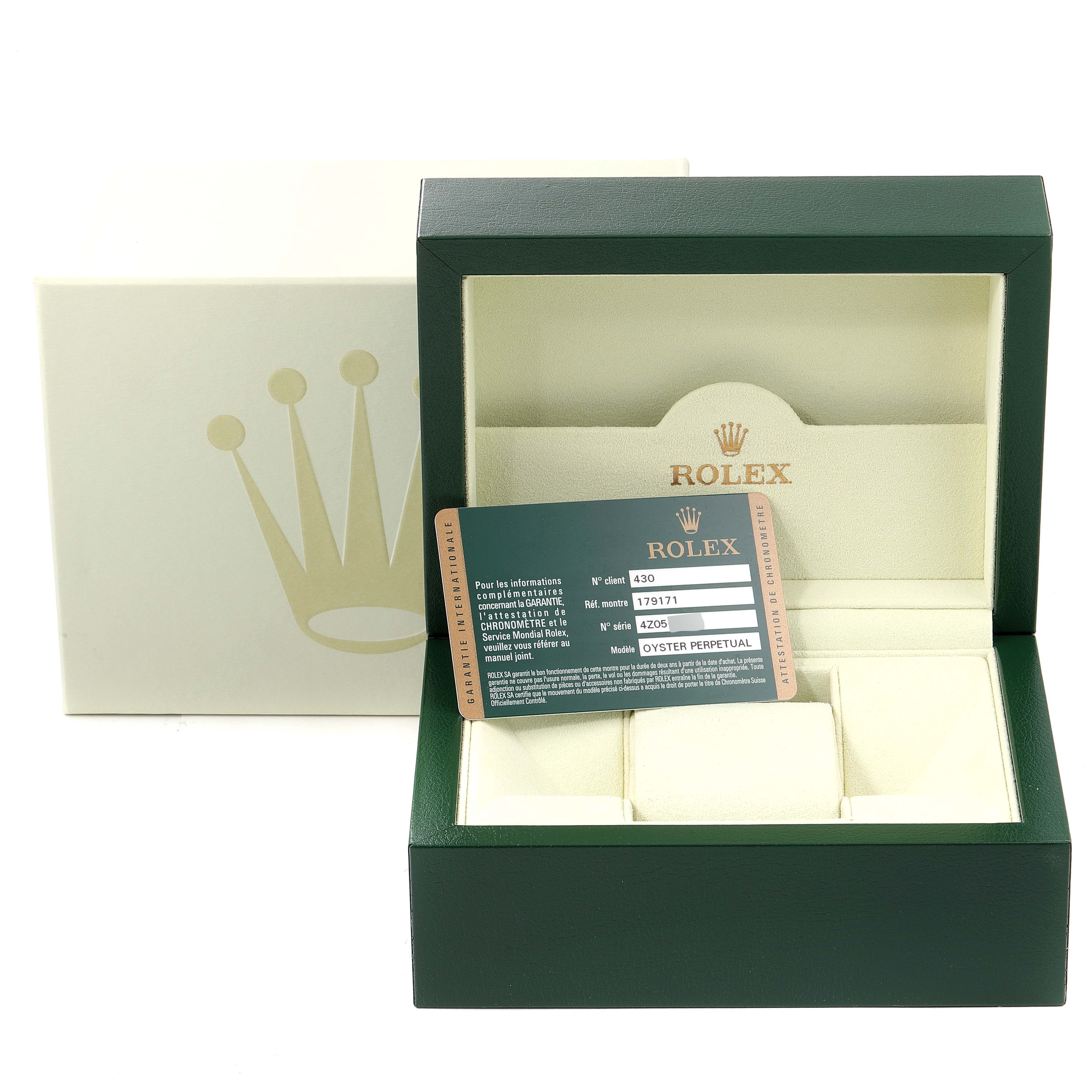 The image shows a green Rolex Datejust 179171 Women's Steel and Gold (two tone) Pink Dial 179171 Women's Steel and Gold (two tone) Pink Dial watch box and a warranty card angled slightly from the front.