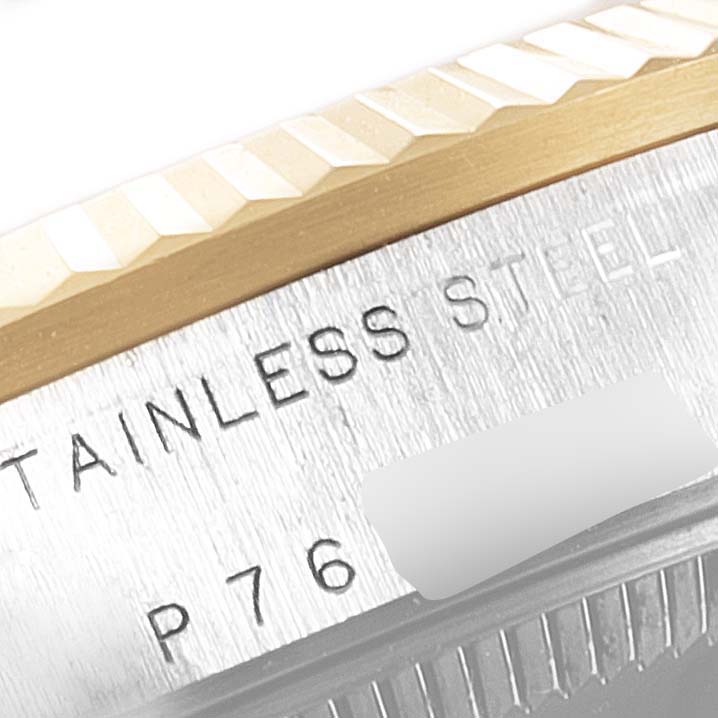 The image shows a close-up angle of the bezel and case of a Mid-Size Rolex watch, highlighting the stainless steel and serial number.