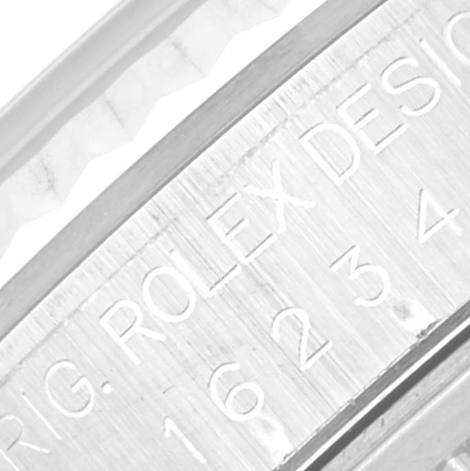 This close-up image shows the engraving on the case of a Rolex Datejust 16234 Men's Stainless Steel Silver Dial 16234 Men's Stainless Steel Silver Dial watch.