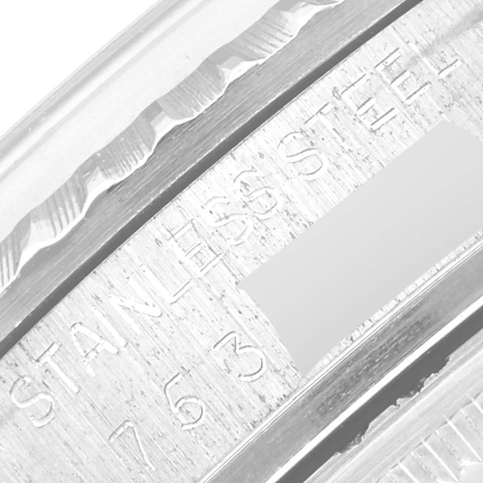 This close-up angle shows the engraved stainless steel case and part of the bezel of the Rolex Vintage Collection 16030 Men's Stainless Steel Silver Dial 16030 Men's Stainless Steel Silver Dial watch.