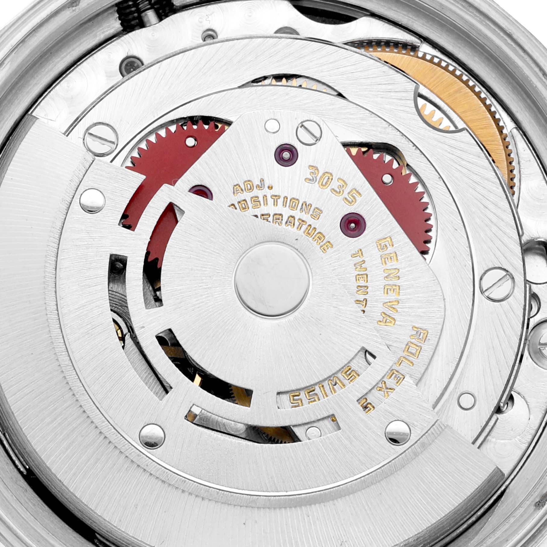Close-up of the internal mechanism of the Rolex Vintage Collection 16030 Men's Stainless Steel Silver Dial 16030 Men's Stainless Steel Silver Dial model, showing gears, screws, and inscriptions.