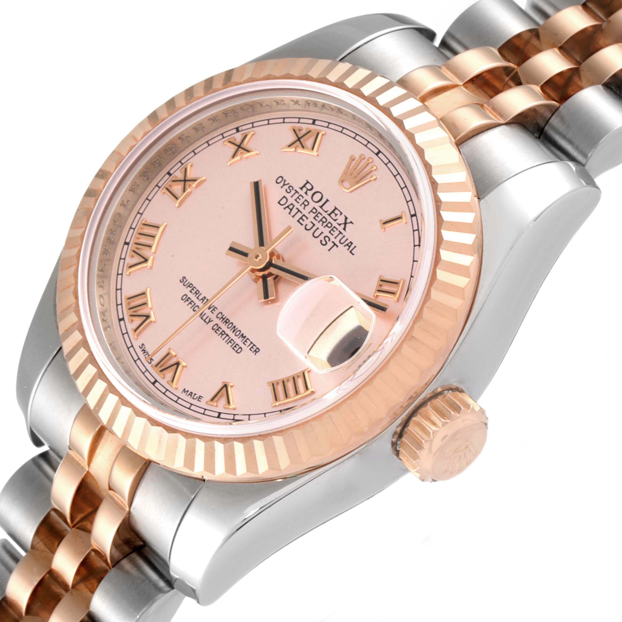 The image shows a close-up, angled view of the Rolex Datejust 179171 Women's Steel and Gold (two tone) Pink Dial 179171 Women's Steel and Gold (two tone) Pink Dial watch, highlighting its dial, bezel, crown, and part of the bracelet.