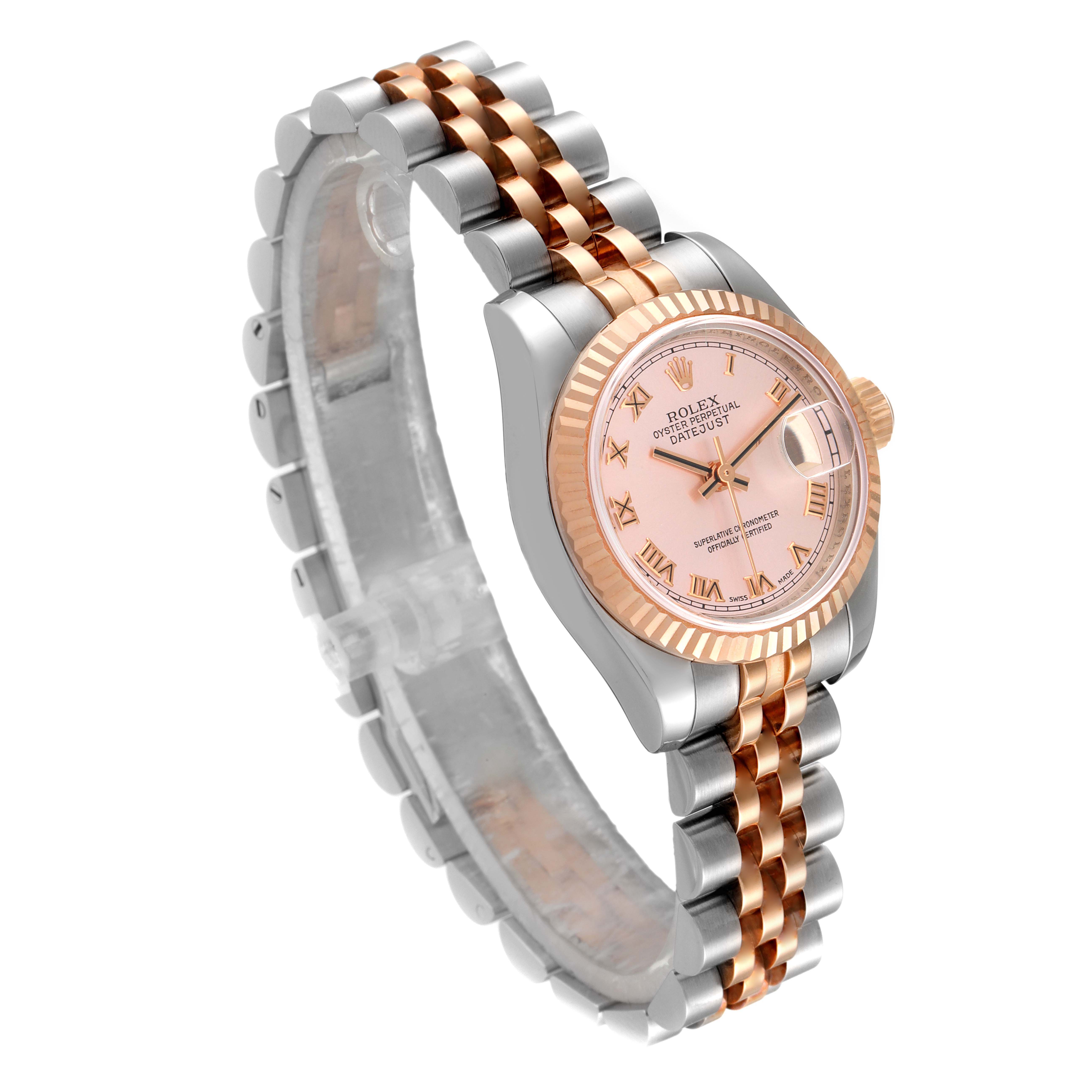 The Rolex Datejust 179171 Women's Steel and Gold (two tone) Pink Dial 179171 Women's Steel and Gold (two tone) Pink Dial watch is shown at an angled view, displaying the pink dial, two-tone bracelet, and fluted bezel.