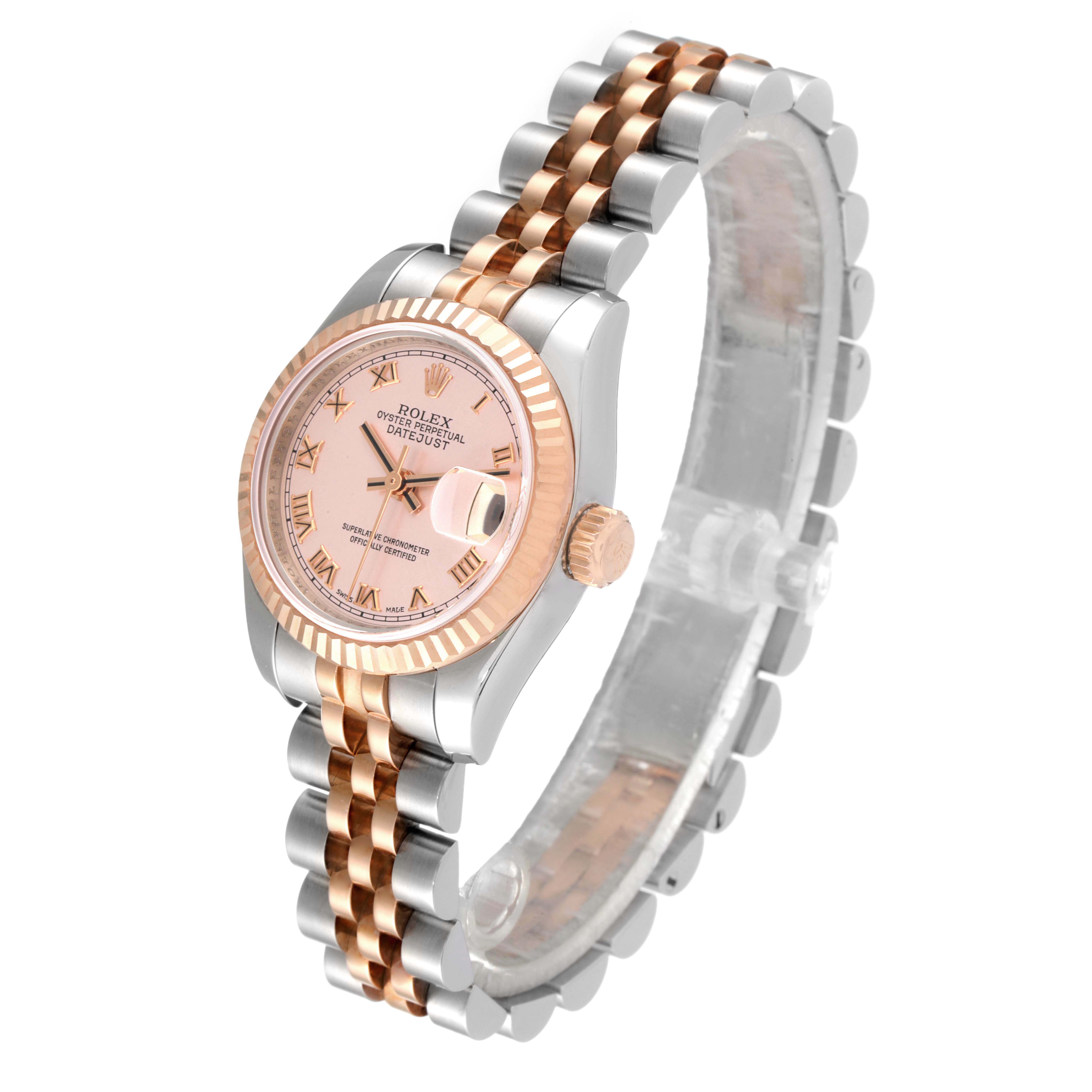 The Rolex Datejust 179171 Women's Steel and Gold (two tone) Pink Dial 179171 Women's Steel and Gold (two tone) Pink Dial watch is shown from an angled side view, displaying its face, bezel, crown, and two-tone bracelet.