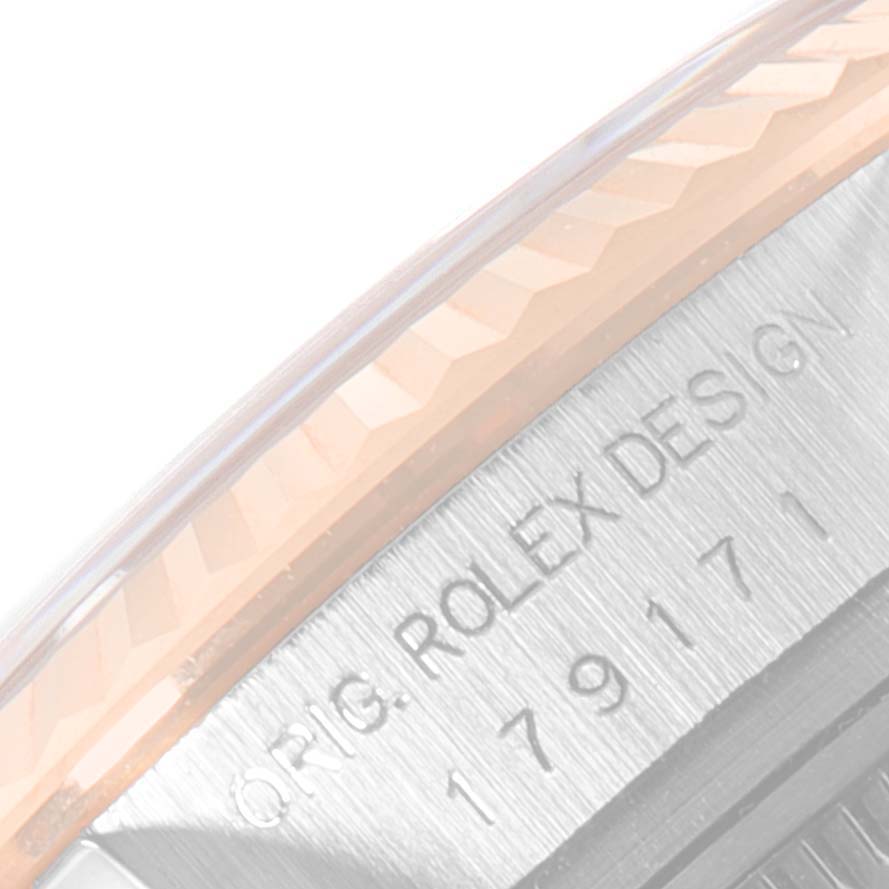 The image shows a close-up of the side of a Rolex Datejust 179171 Women's Steel and Gold (two tone) Pink Dial 179171 Women's Steel and Gold (two tone) Pink Dial watch, highlighting the engraved text and fluted bezel.