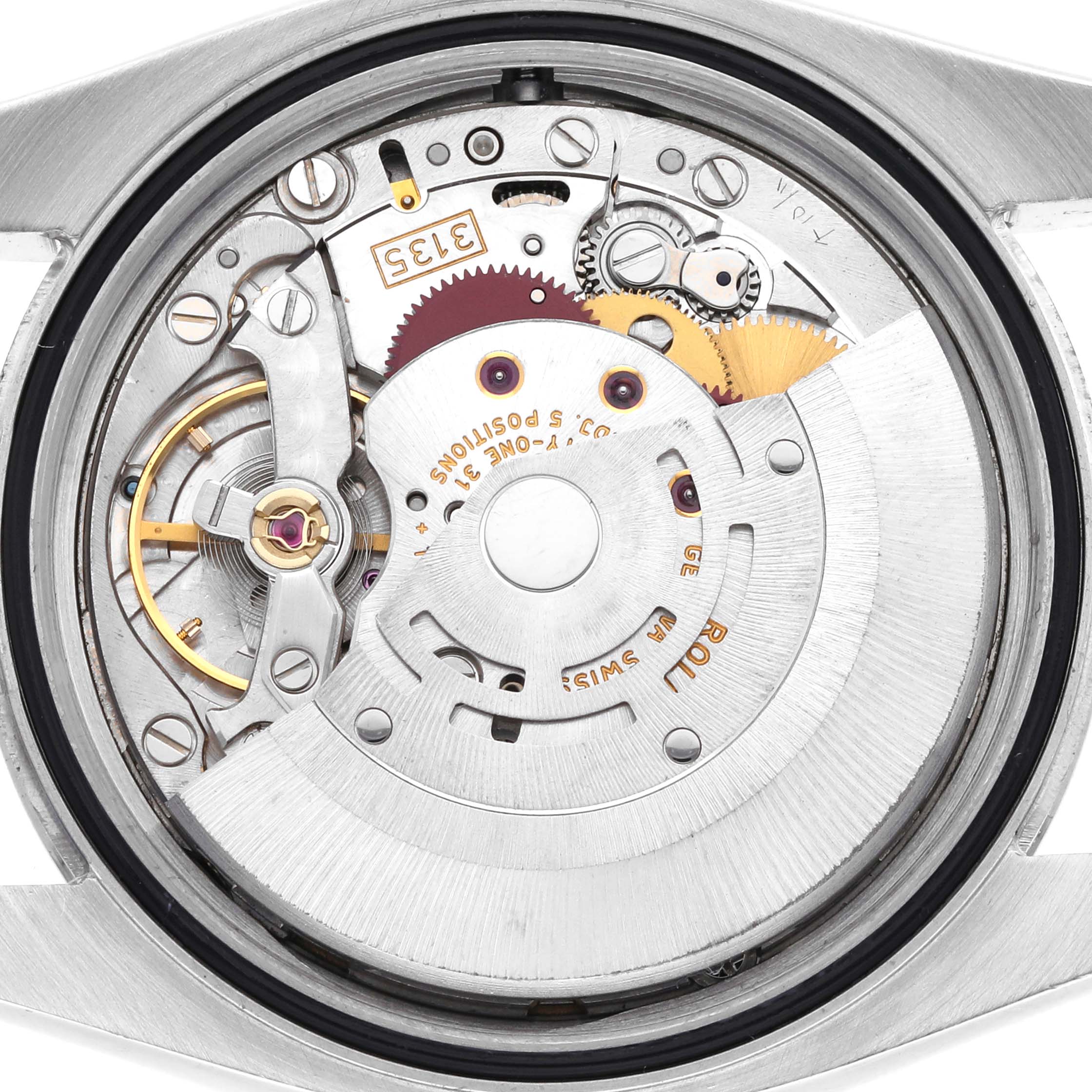 The image shows the movement of a Rolex Datejust 116234 Men's Stainless Steel White Dial 116234 Men's Stainless Steel White Dial watch from a back angle, revealing gears and components.