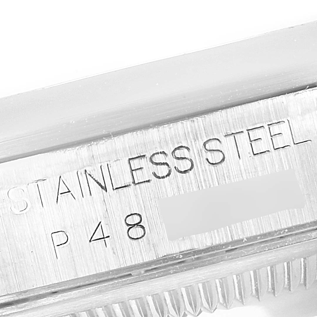 The image shows a close-up of the Rolex Datejust 16200 Men's Stainless Steel White Dial's case with "STAINLESS STEEL" engraved.