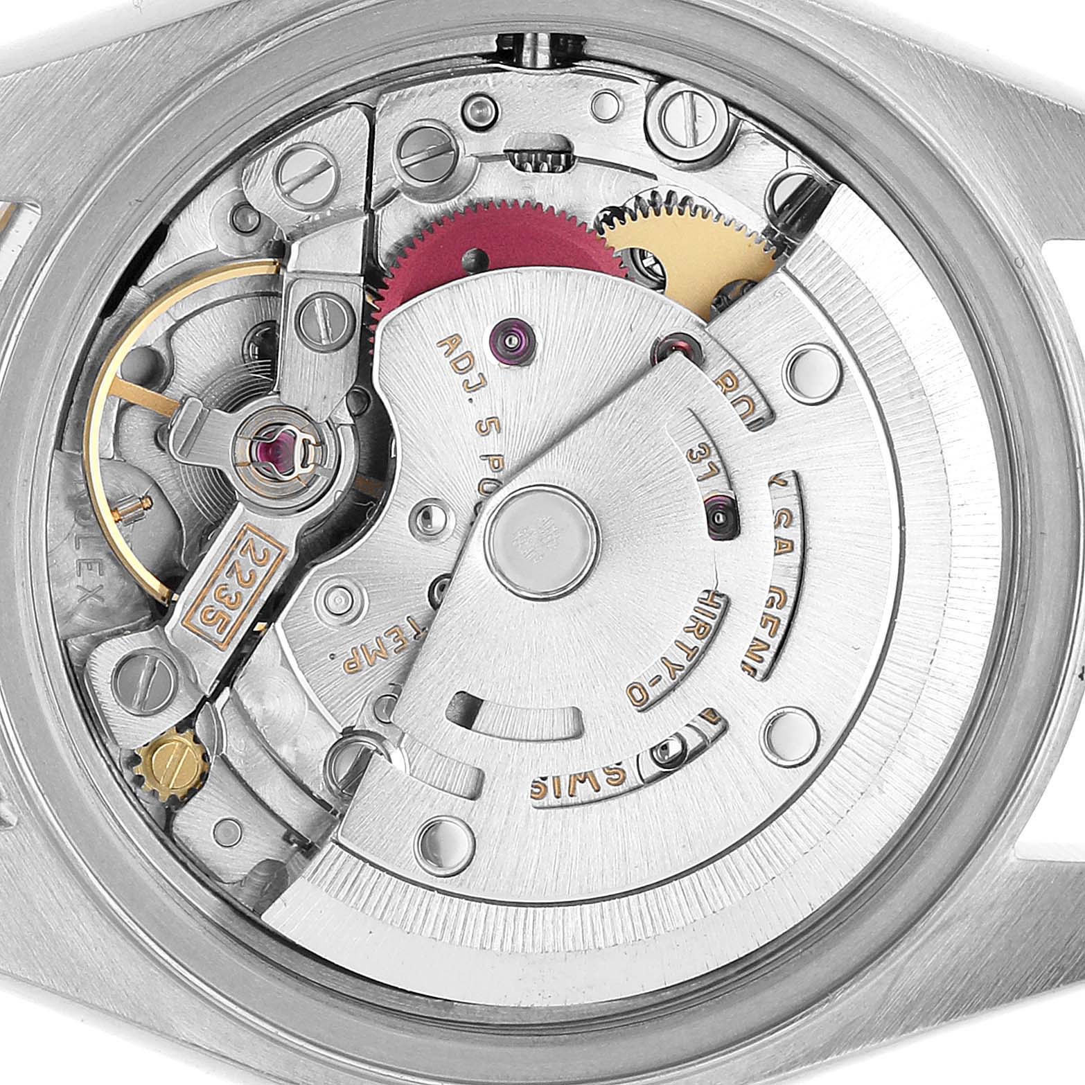 The image shows the intricate internal movement of a Rolex Datejust 79173 Women's Steel and Gold (two tone) Black Dial watch from a top-down angle.