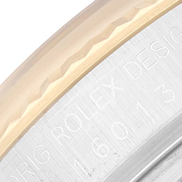 The image shows a close-up angle of the bezel and engraved case of the Vintage Collection model by Rolex.