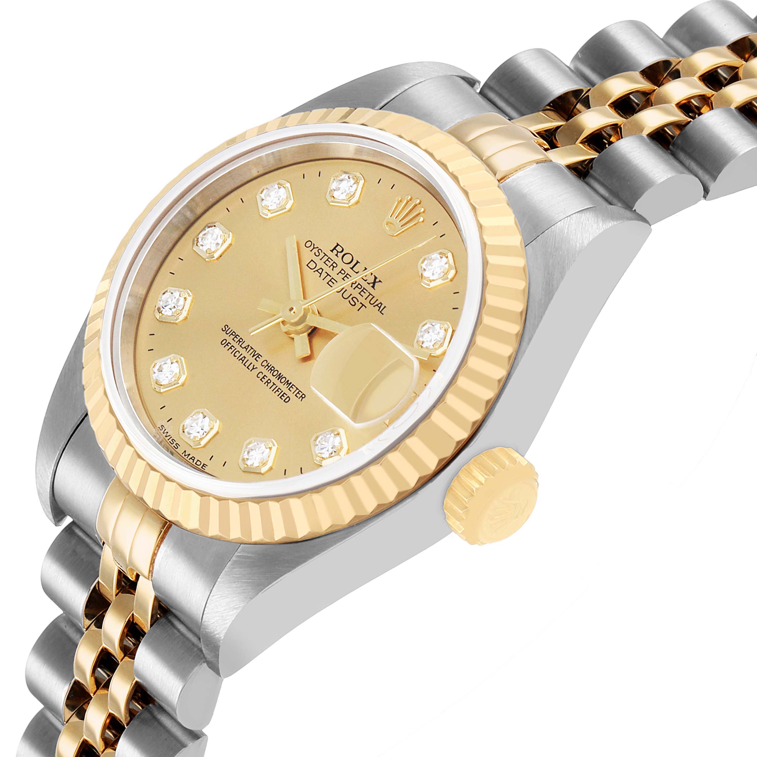 The image shows a Rolex Datejust 79173 Women's Steel and Gold (two tone) Champagne Dial watch at a slight side angle, highlighting the gold and silver bezel, dial, crown, and jubilee bracelet.